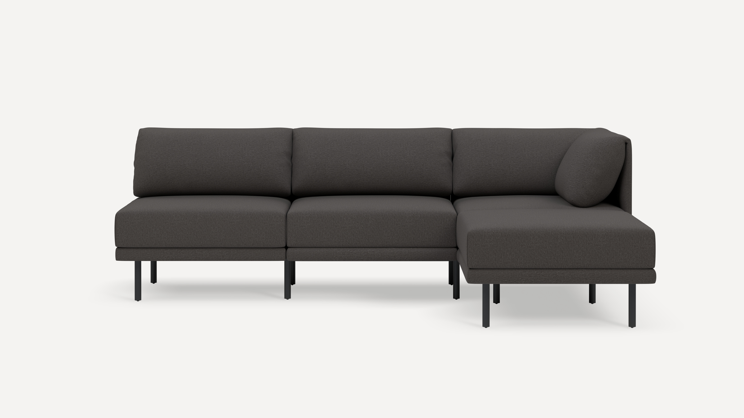 Modern dark gray sectional sofa with clean lines, slim black legs, and cushioned backrests, featuring a chaise lounge on the right side.