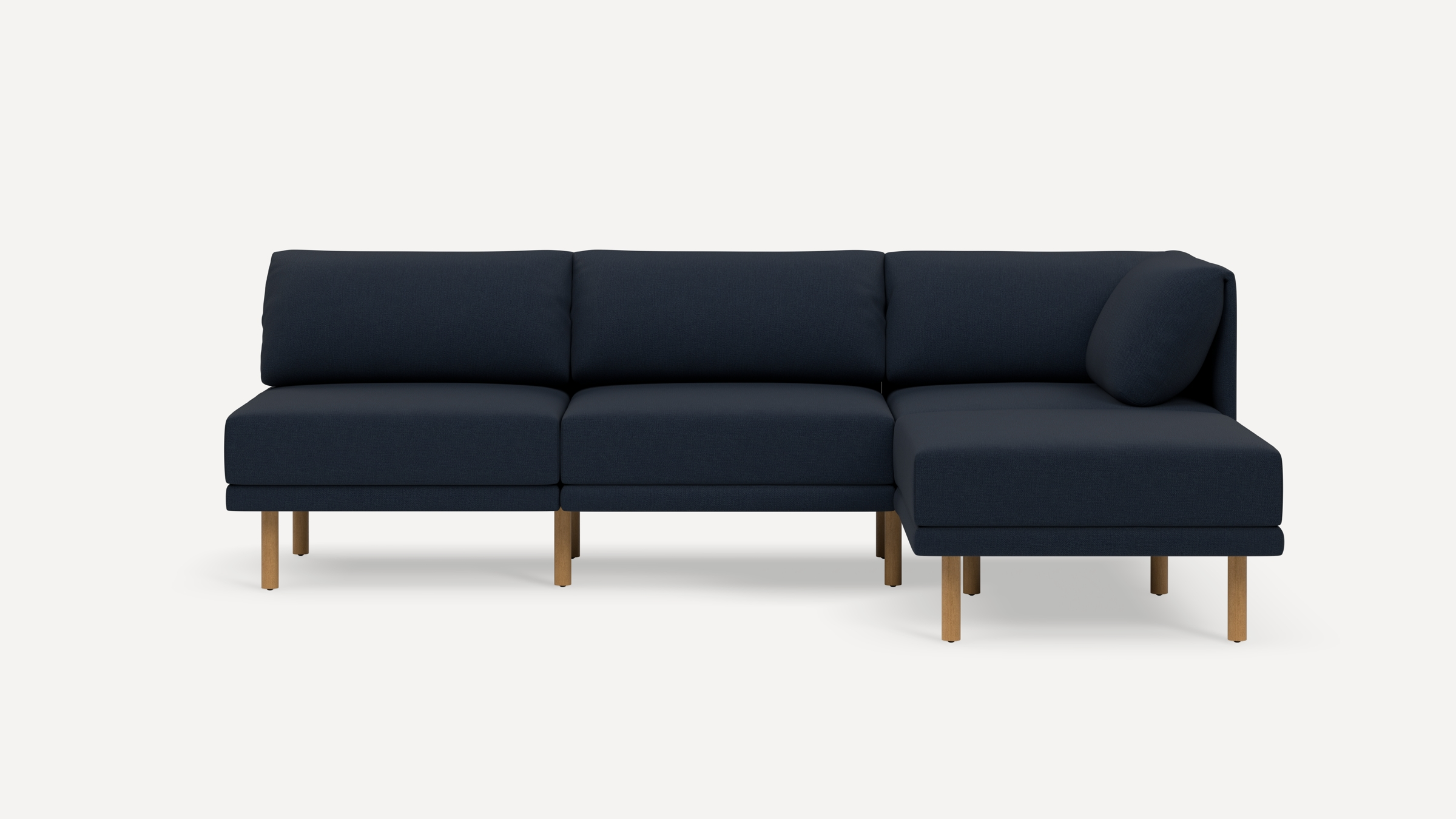 Modern navy blue sectional sofa with wooden legs, featuring a right-side chaise lounge and cushioned backrest.