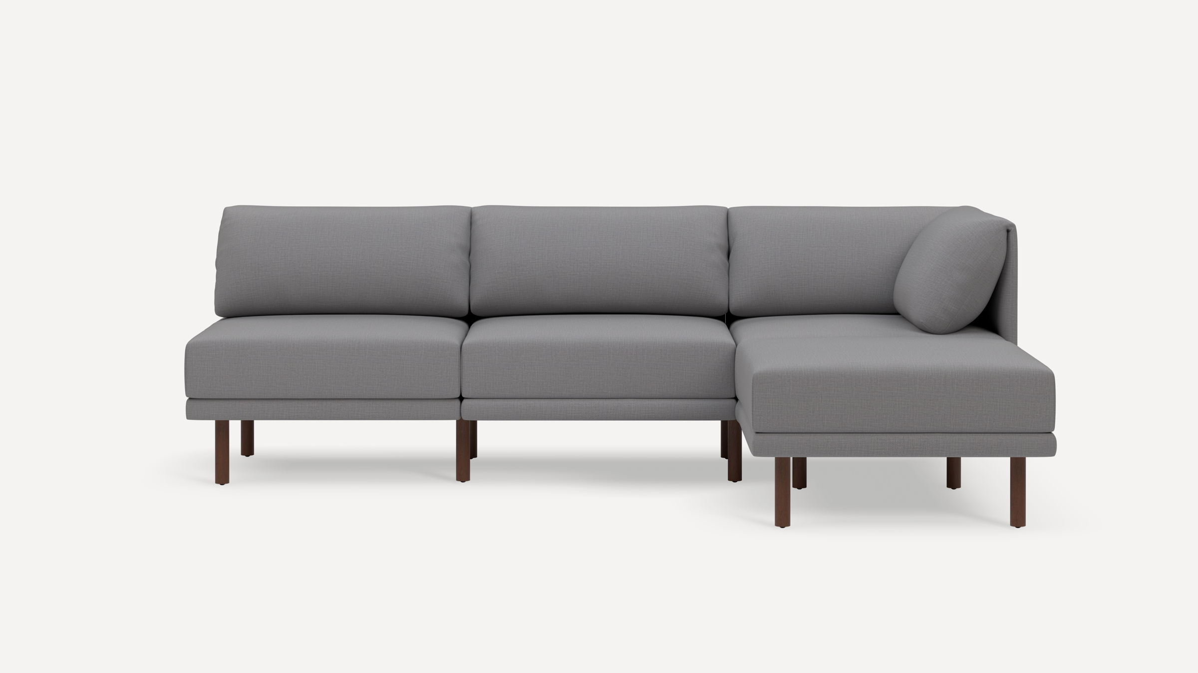 Modern gray three-seater sectional sofa with wooden legs and a right-side chaise lounge on a white background.