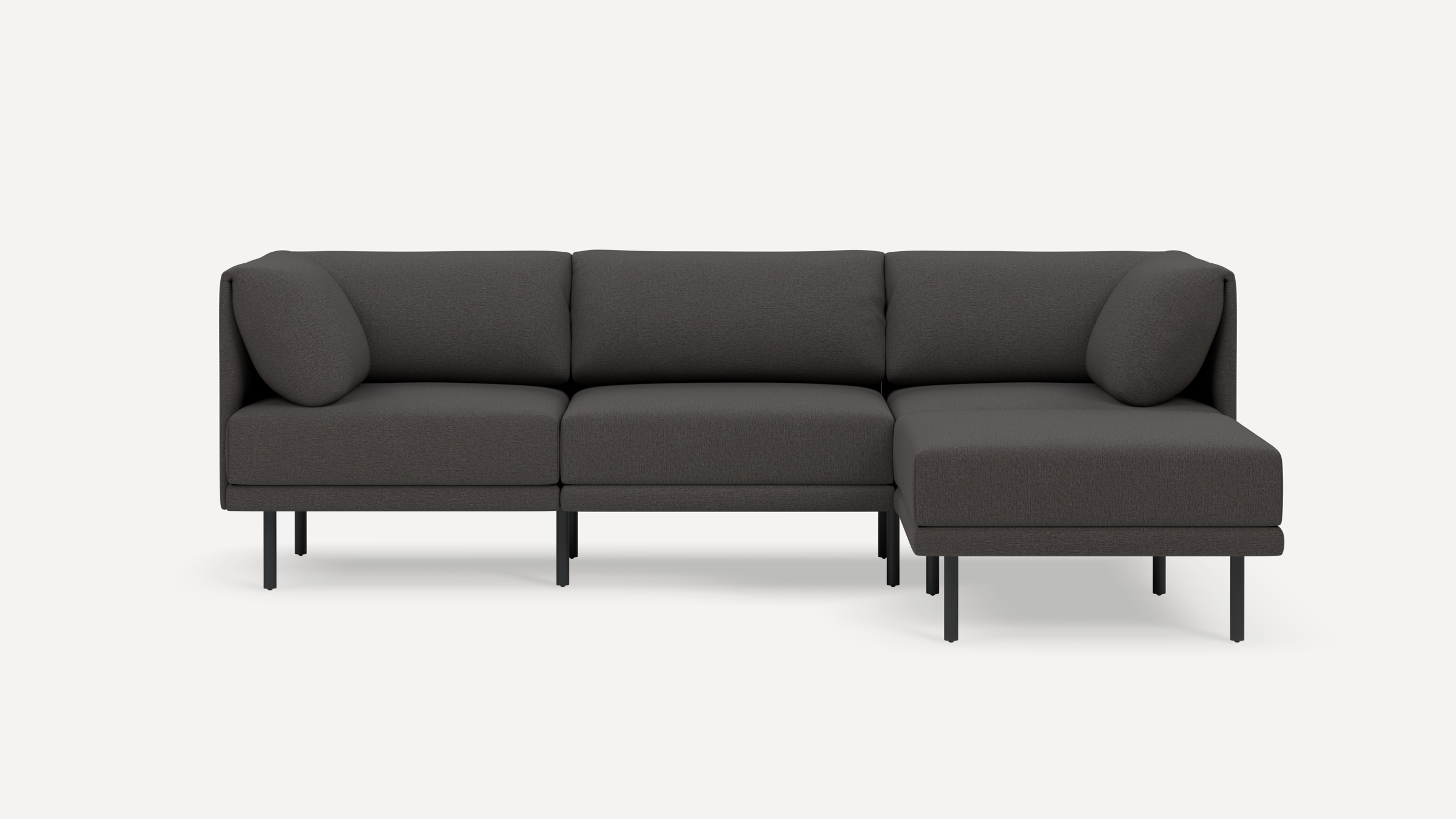 Modern dark gray sectional sofa with clean lines, cushioned seats and backs, and slim black metal legs on a white background.