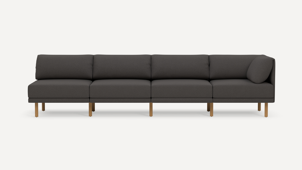 Modern dark gray fabric sectional sofa with wooden legs, featuring clean lines and a minimalist design against a plain white background.