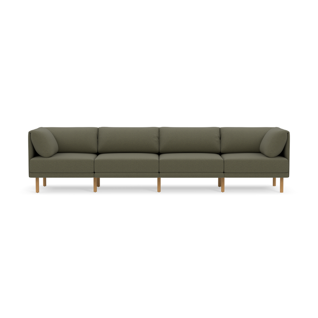 Large modern Moss green fabric sectional sofa with wooden legs and clean, straight lines, set against a black background.