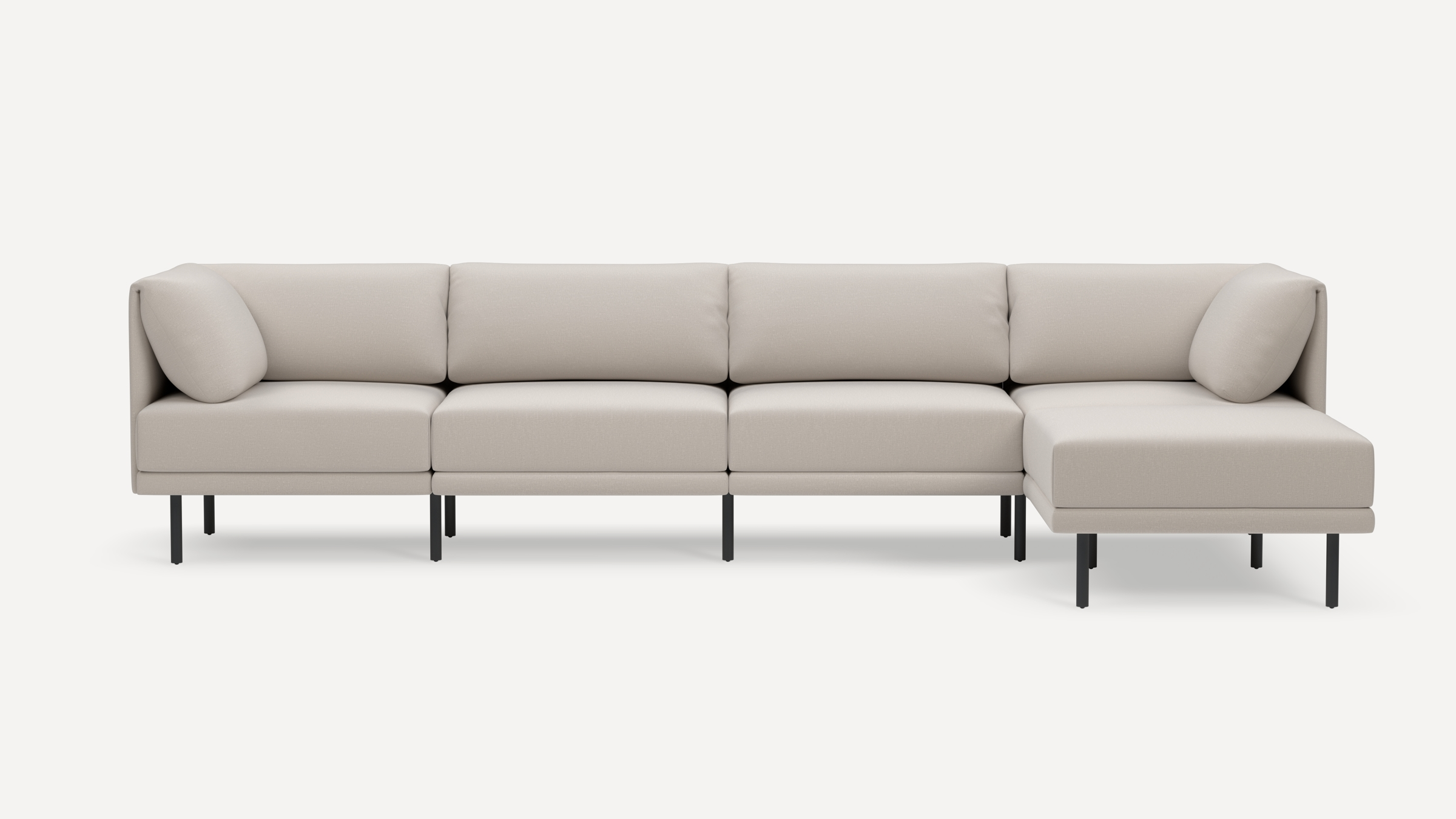 Modern beige sectional sofa with clean lines, metal legs, and plush cushions, featuring a right-side chaise lounge.