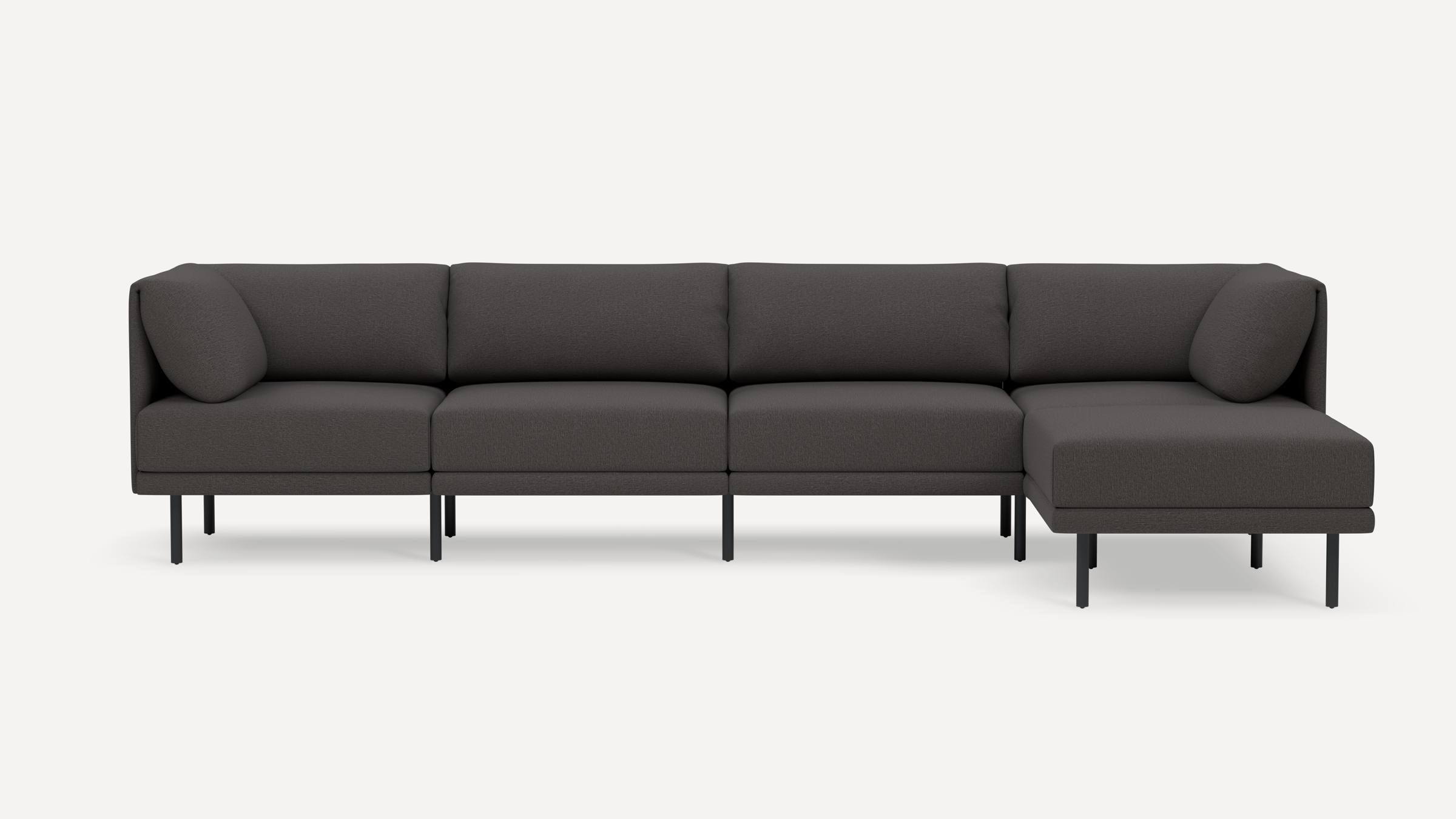 Modern dark gray sectional sofa with metal legs, three seat cushions, and a chaise lounge on the right side.