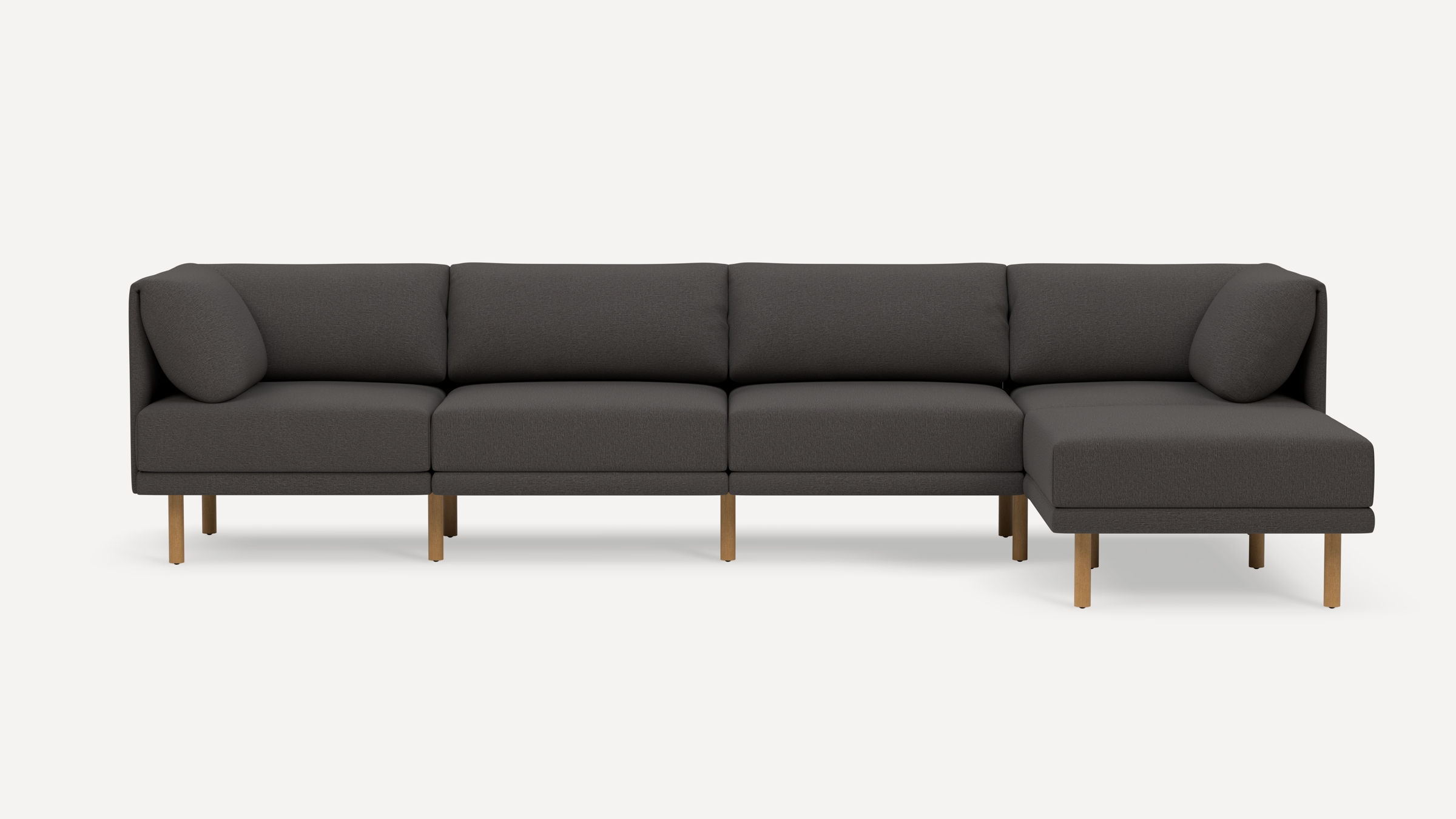 Modern dark gray sectional sofa with wooden legs, featuring a right-side chaise and plush cushioned backrests.
