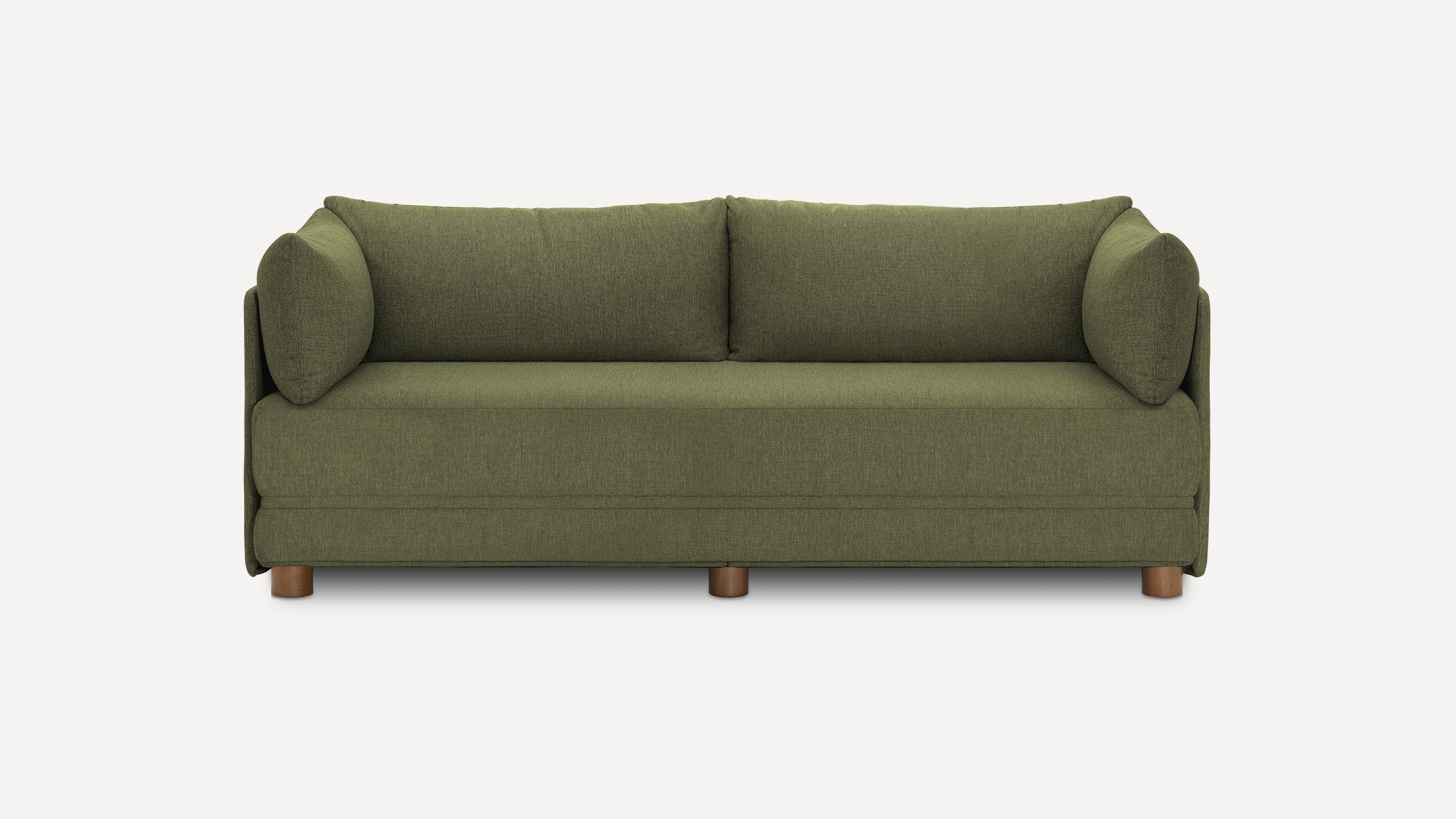 Green upholstered modern sofa with three wooden legs, two back cushions, and two cylindrical arm pillows, set against a plain white background.