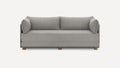 Modern three-seater sofa in light gray fabric with rounded armrests, loose back cushions, and wooden legs on a white background.
