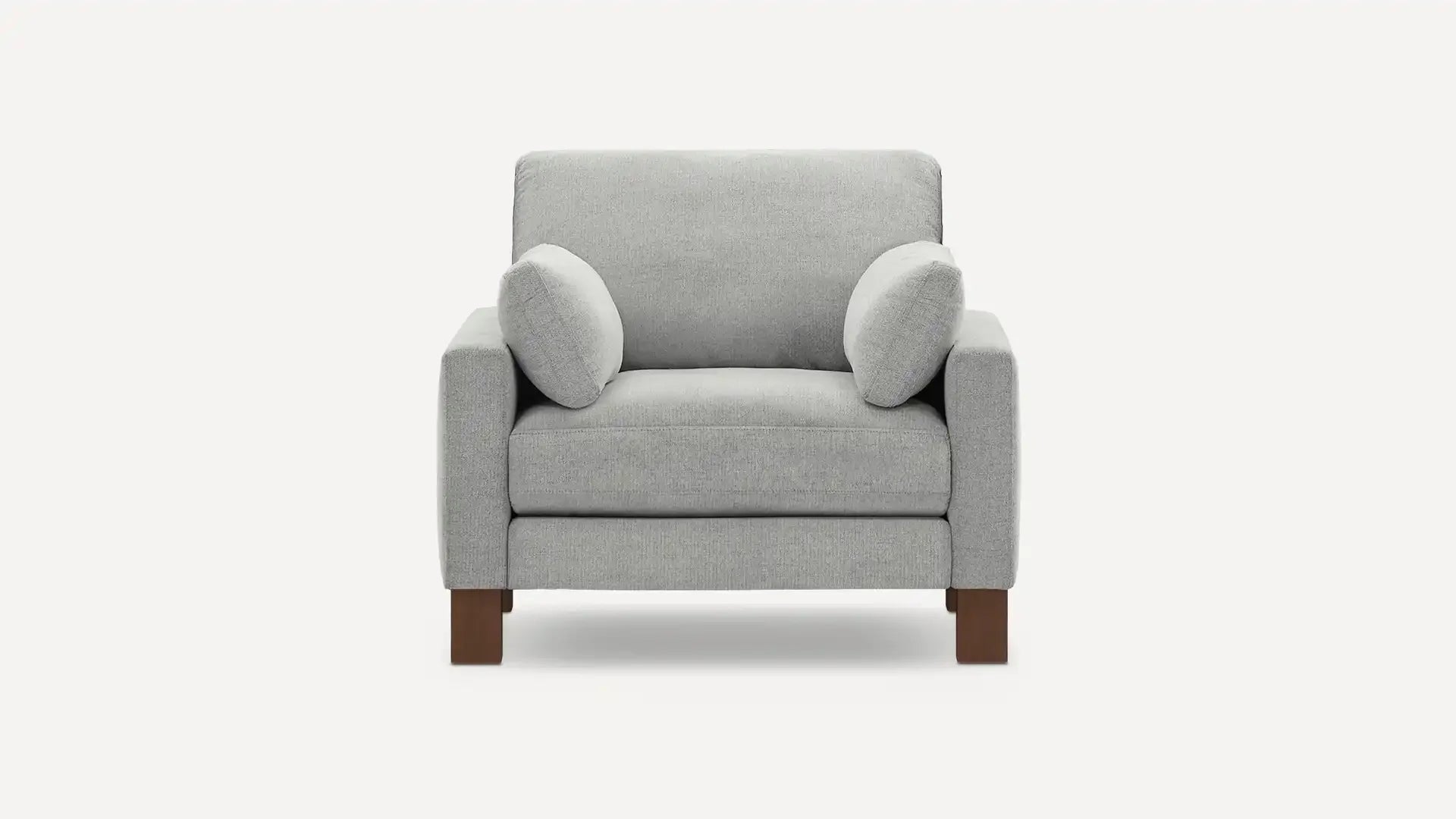 modern light gray upholstered armchair with wooden legs and a cushioned backrest, featuring a soft, plush cushioned seat and a wooden