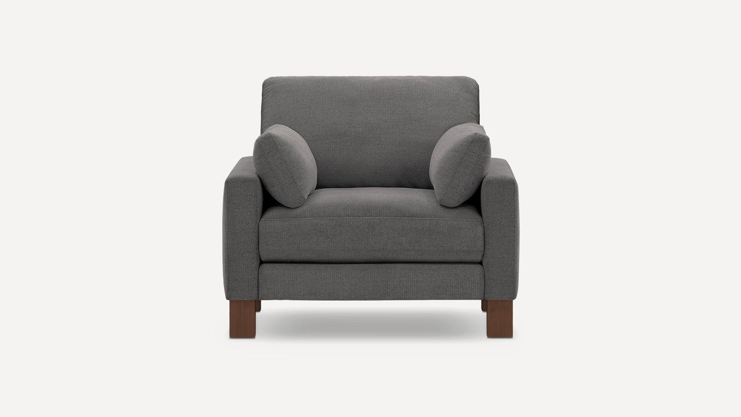 Front view of a modern gray fabric armchair with two matching small cushions and wooden legs.