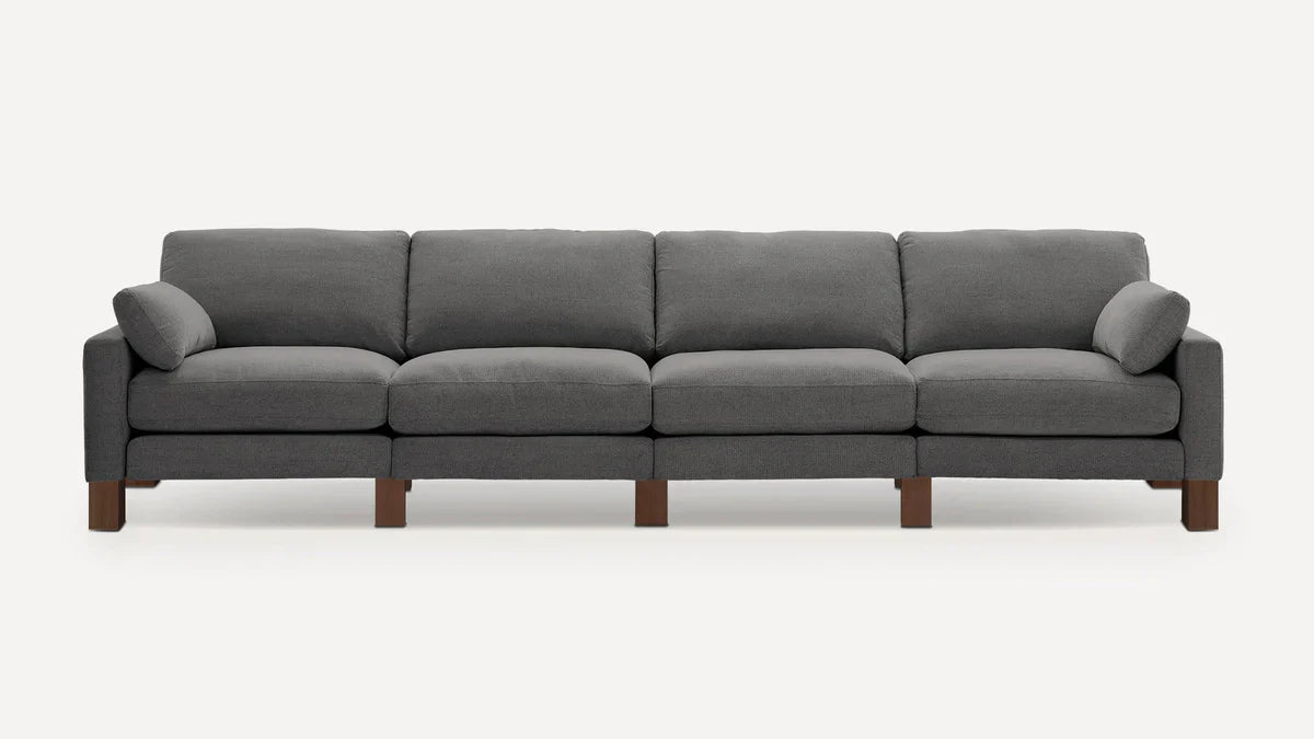 modern gray fabric sectional sofa with wooden legs and clean lines on the back, featuring clean lines and clean lines on the arms