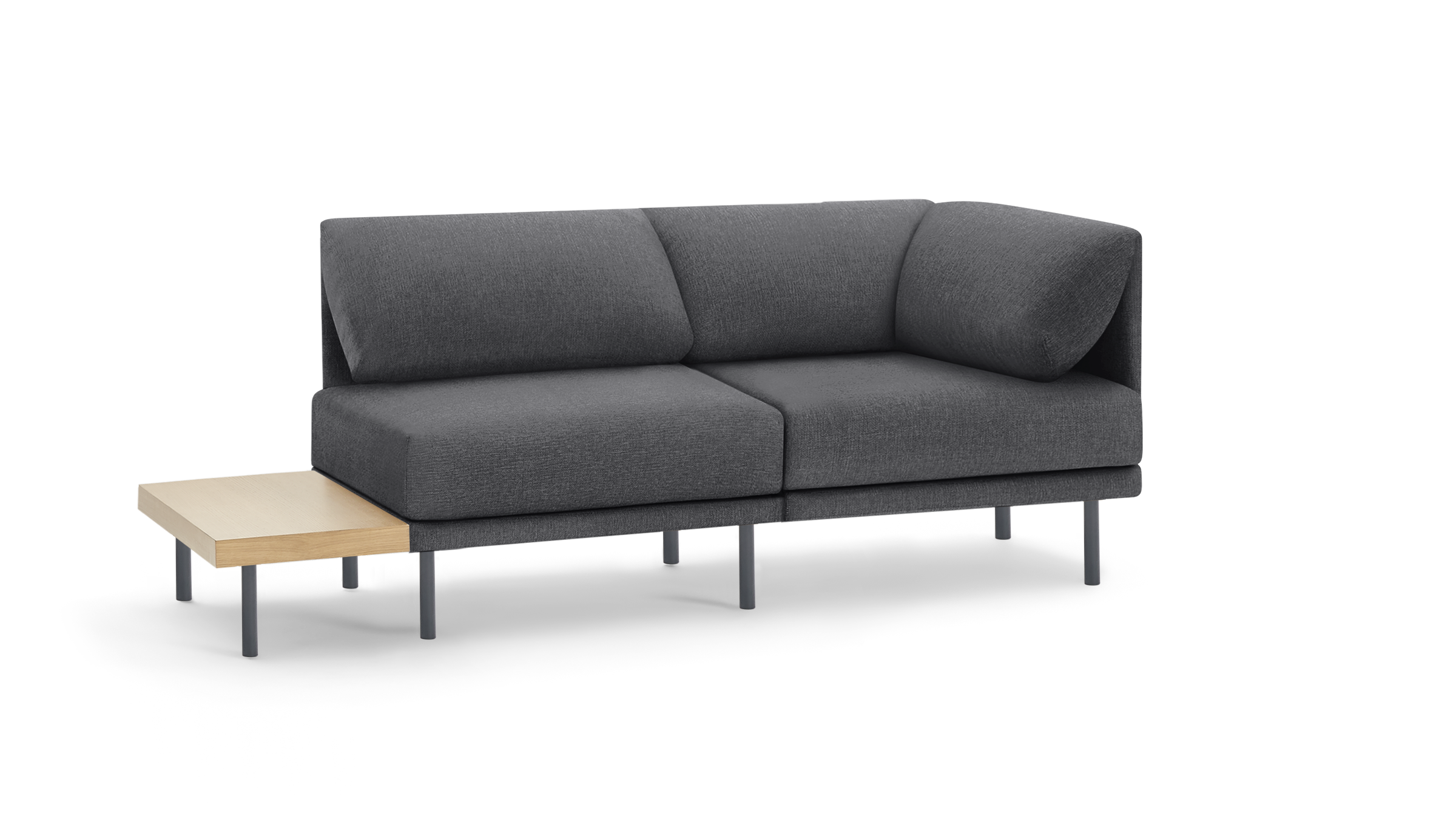 modern gray fabric sectional sofa with black metal legs and a wooden side table on a black background