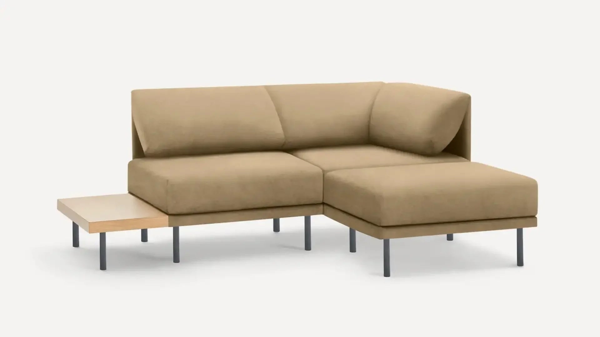 modern beige sectional sofa with chaise lounge and wooden side table on a white background