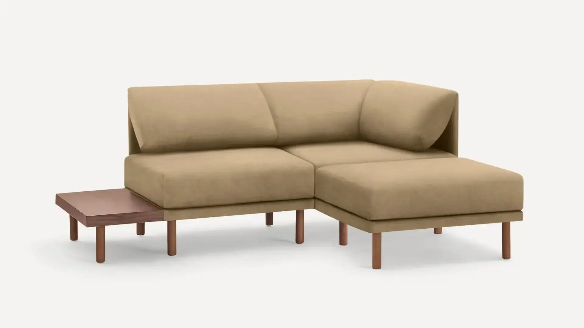 modern beige sectional sofa with wooden legs and a chaise lounge on a white background