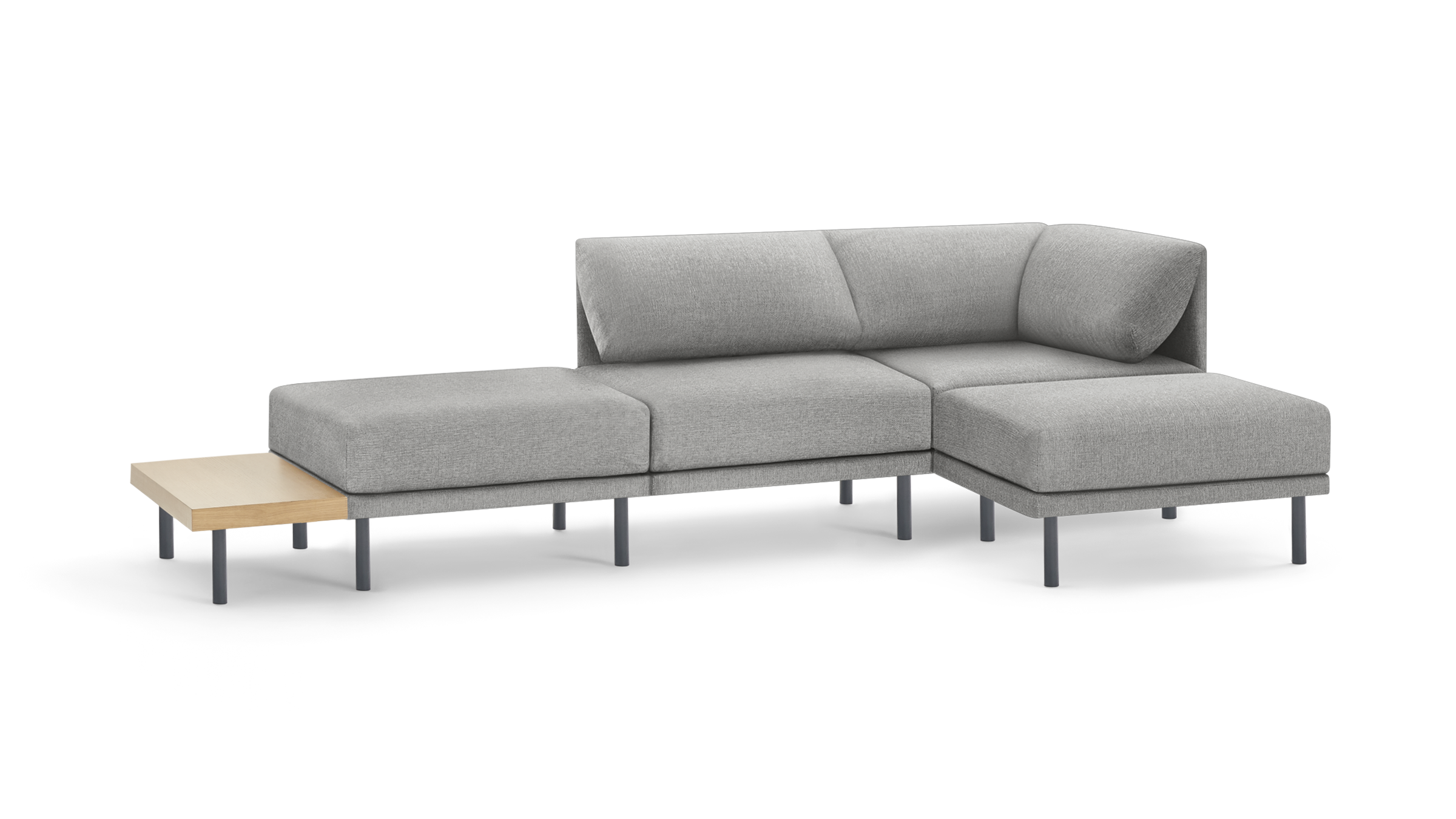 light gray modern l - shaped sectional sofa with matching ottoman, featuring sleek metal legs and a wooden tablet table on the left side