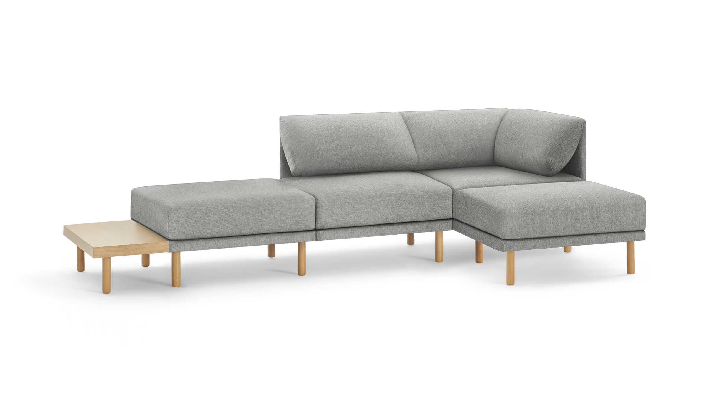 light gray fabric sectional sofa with wooden legs and matching ottoman, featuring a clean, modern design
