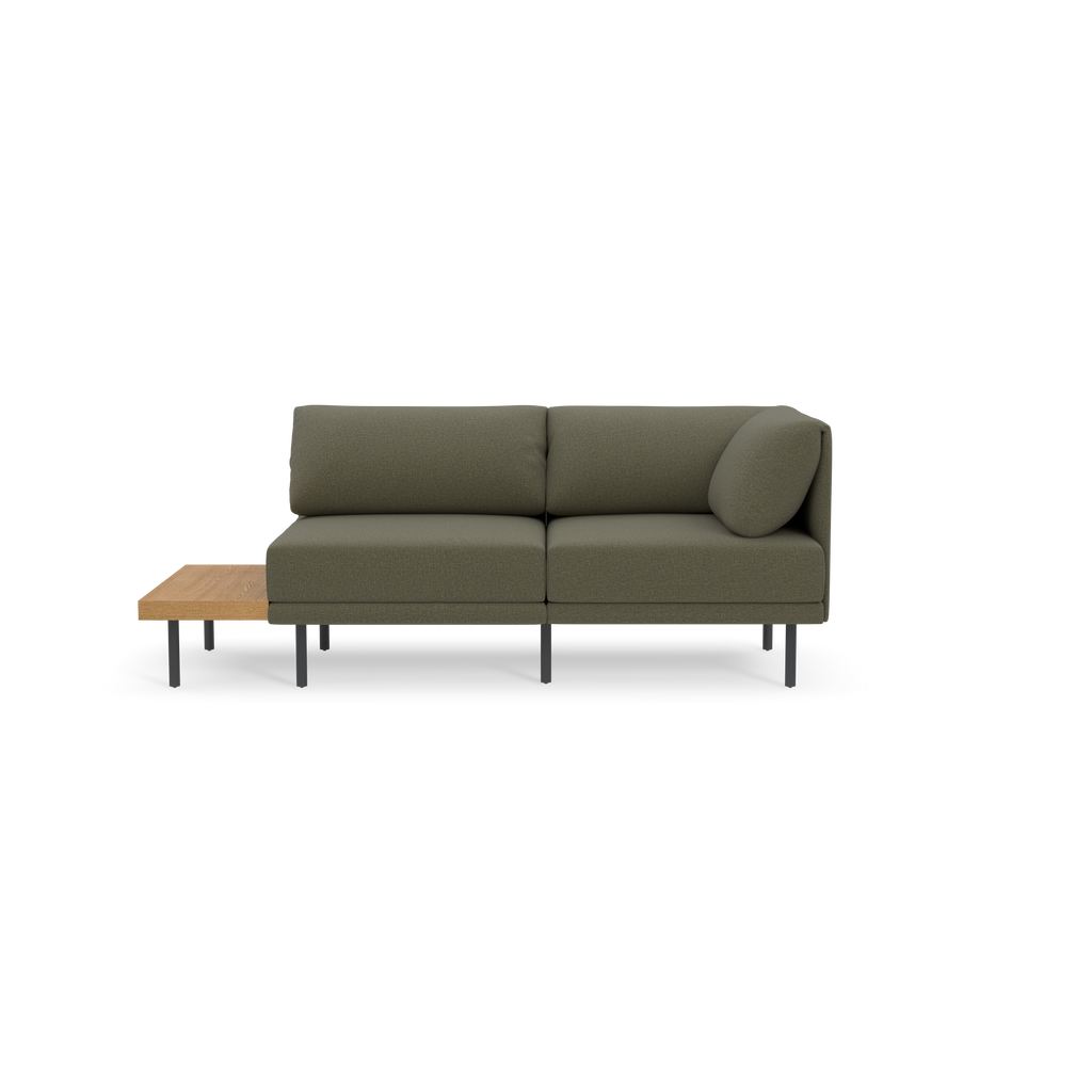 Modern Moss green fabric sectional sofa with a built-in wooden side table and black metal legs, isolated on black background.