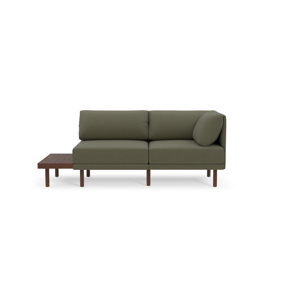 Modern Moss green two-seater sofa with wooden legs and an integrated side table on the left side, set against a black background.