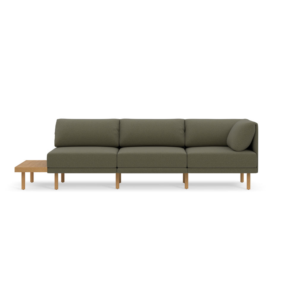 Modern Moss green modular sofa with wooden legs, three seat cushions, three back cushions, and an attached wooden side table on the left.