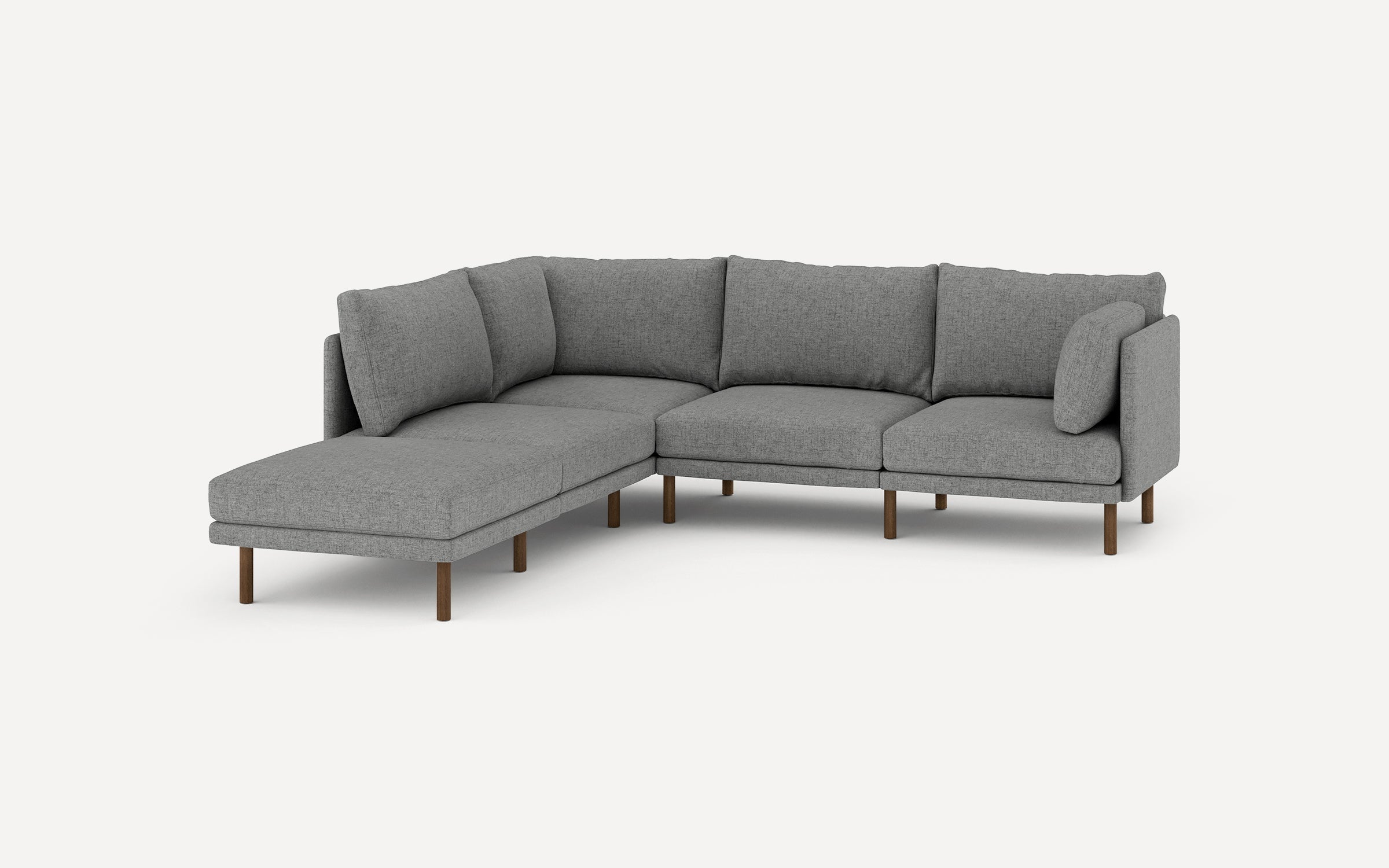 modern l - shaped sectional sofa with light gray upholstery, wooden legs, and clean lines on a white background