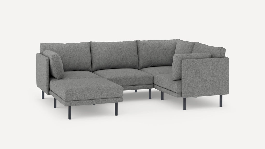Modern gray fabric L-shaped sectional sofa with thin black legs and matching cushions against a white background.