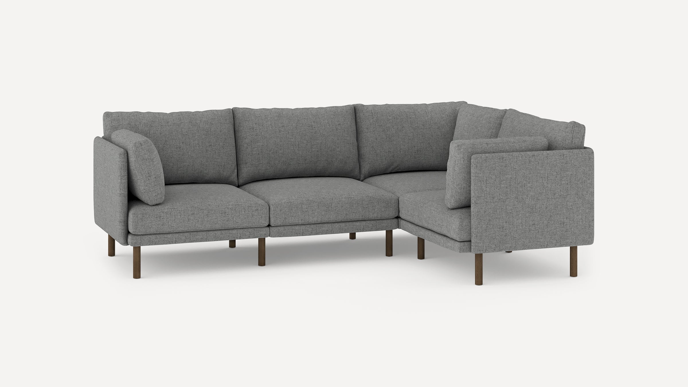 modern l - shaped sectional sofa with light gray fabric upholstery, wooden legs, and clean lines on a white background