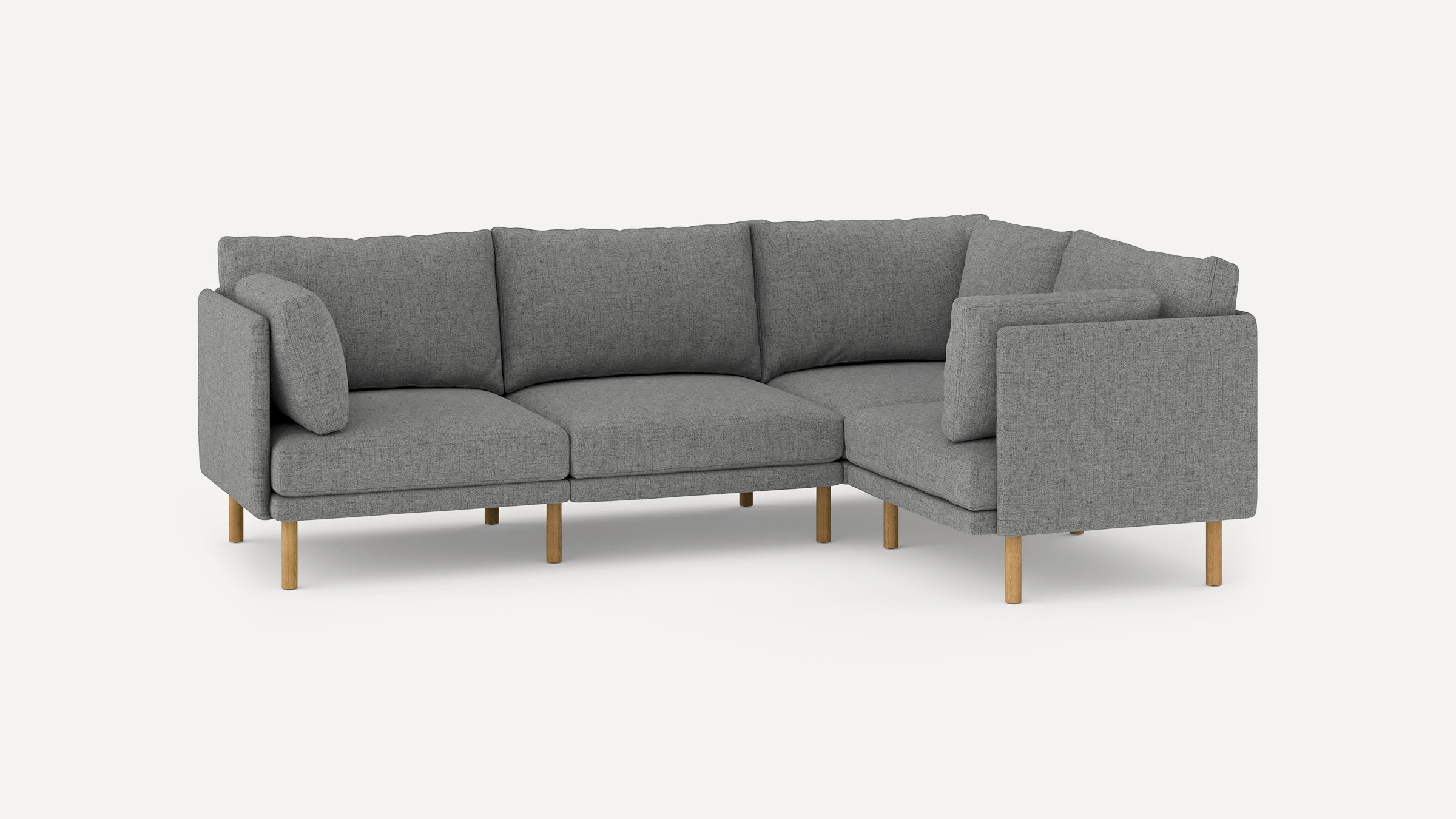 modern l - shaped sectional sofa with light gray fabric upholstery, wooden legs, and clean lines on a white background