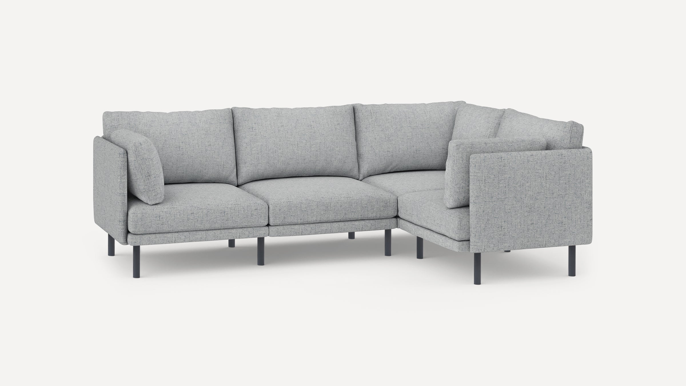 Light gray upholstered L-shaped sectional sofa with metal legs and thick cushioned seats and backrests.