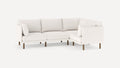 modern l - shaped sectional sofa with clean lines and wooden legs, featuring a soft white fabric upholstery, and a clean, minimal