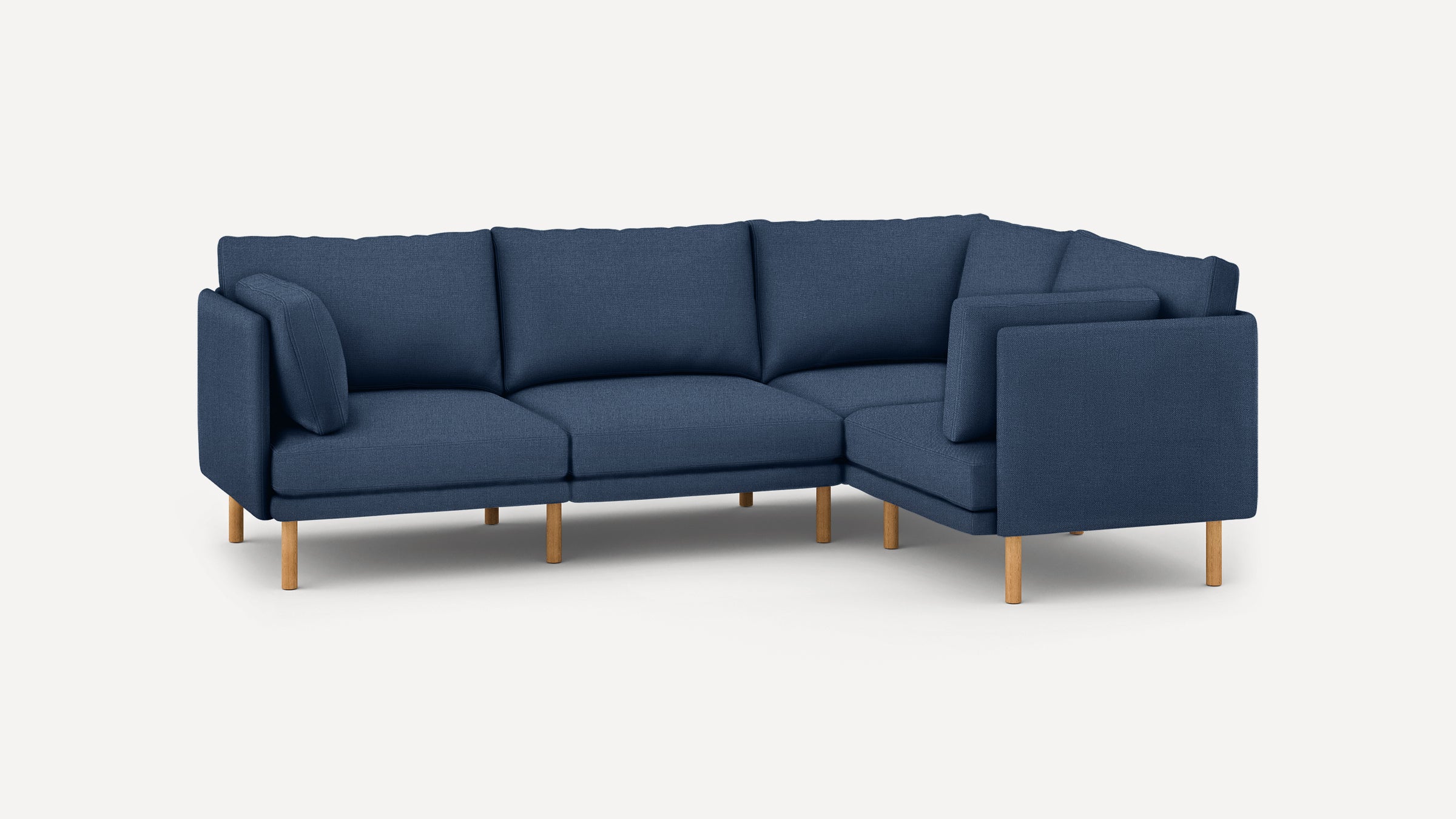 modern navy blue fabric sectional sofa with wooden legs and clean lines on the back, featuring clean lines and clean lines on the arms