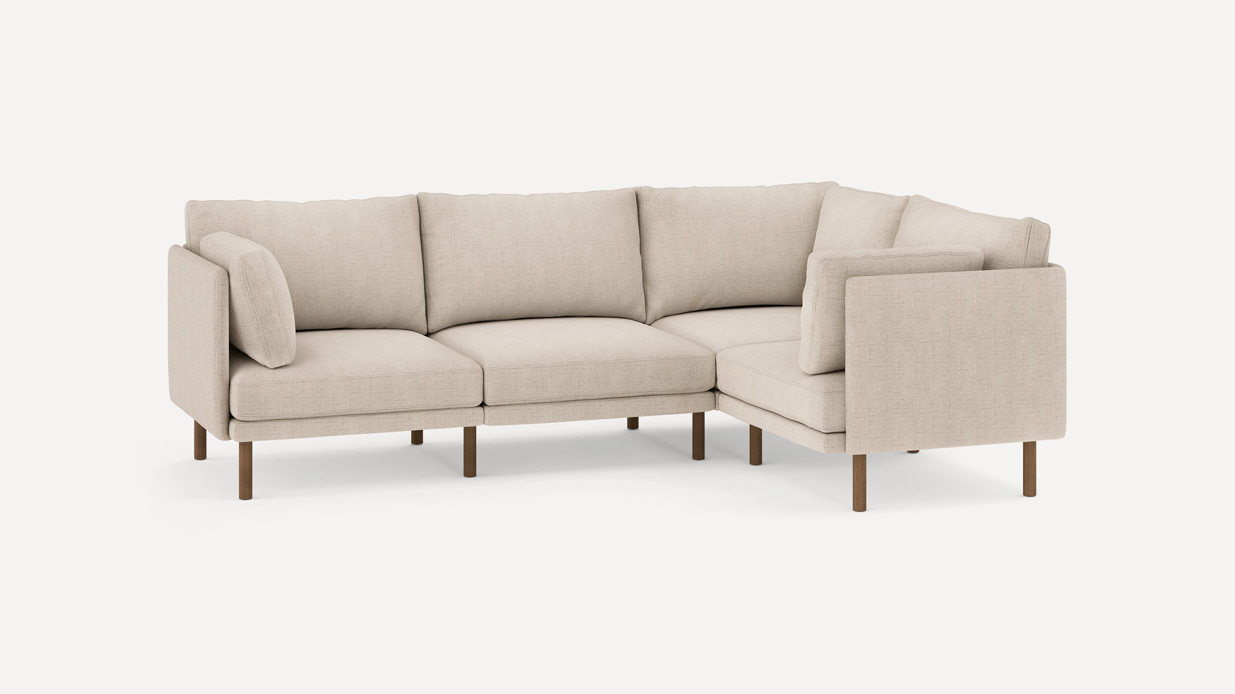 Beige fabric L-shaped sectional sofa with wooden legs and cushioned seats and backrests, modern minimalist design.