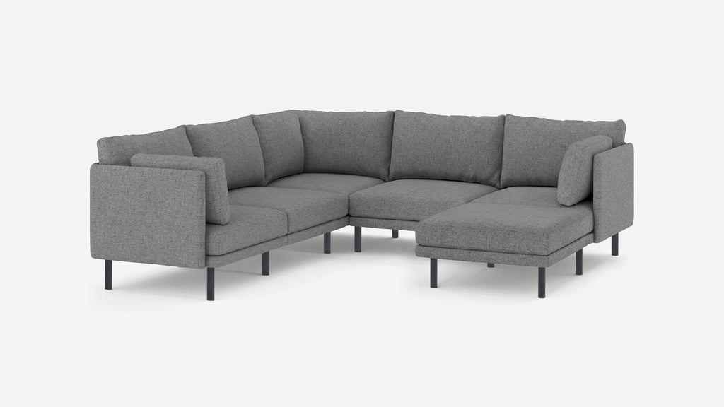 Gray fabric sectional sofa with metal legs, featuring a chaise on the right side and plush back cushions.