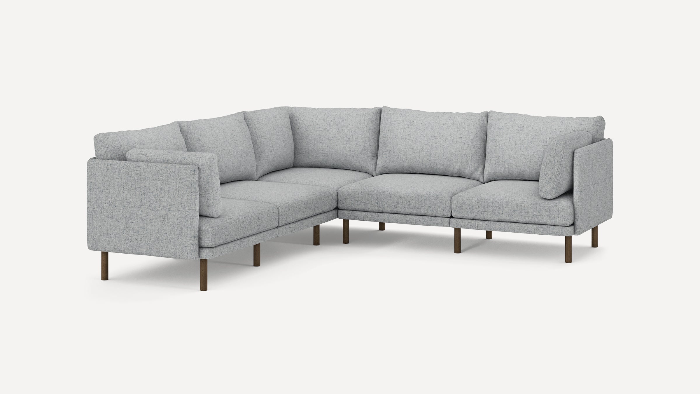 Light gray L-shaped sectional sofa with fabric upholstery, cushioned seats, angled back cushions, and wooden legs on plain white background.