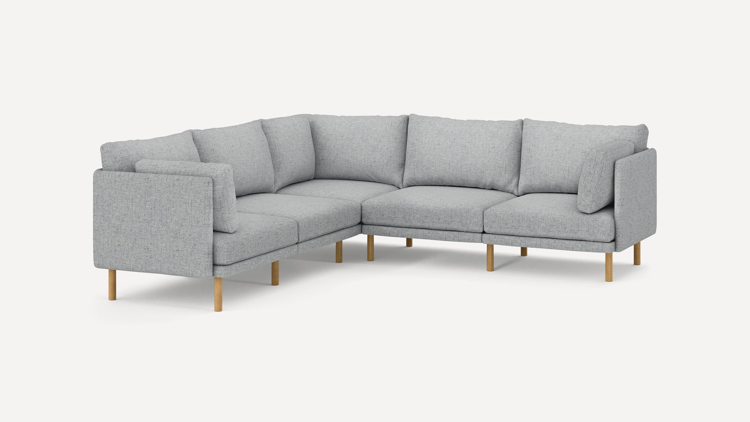 Light gray L-shaped sectional sofa with wooden legs and plush back and seat cushions, modern minimalist design.