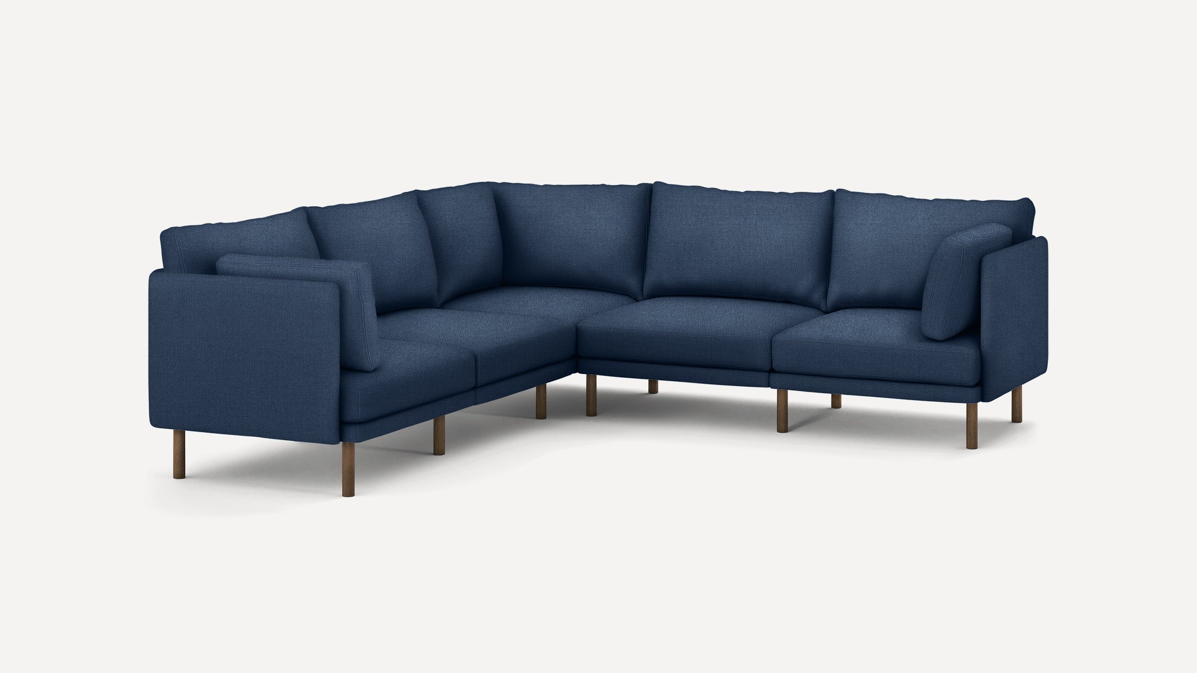 modern navy blue sectional sofa with wooden legs and clean lines on the back, featuring a deep cushioned design and clean lines on the front