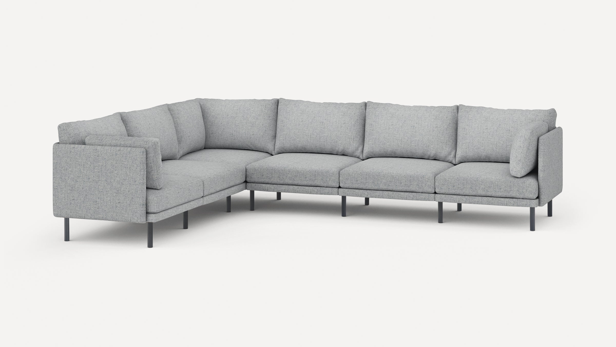 Modern L-shaped sectional sofa with light gray fabric upholstery, cushioned seats, backrests, and slim black metal legs.