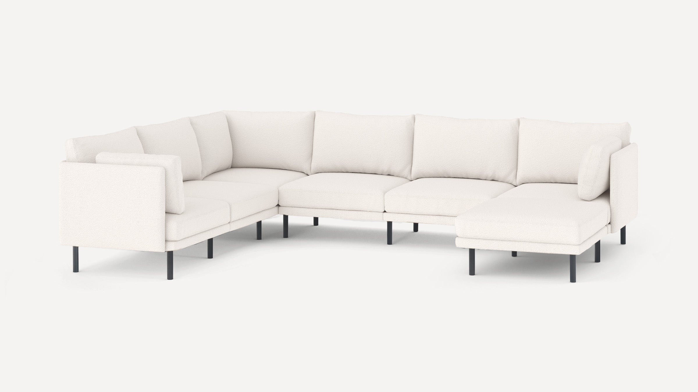 Modern white L-shaped sectional sofa with plush cushions and black metal legs, designed for spacious living rooms.