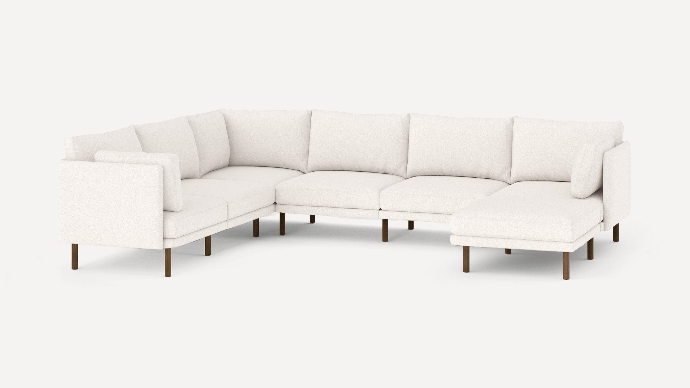 Modern L-shaped sectional sofa with white upholstery, wooden legs, and multiple cushioned seats and backrests.