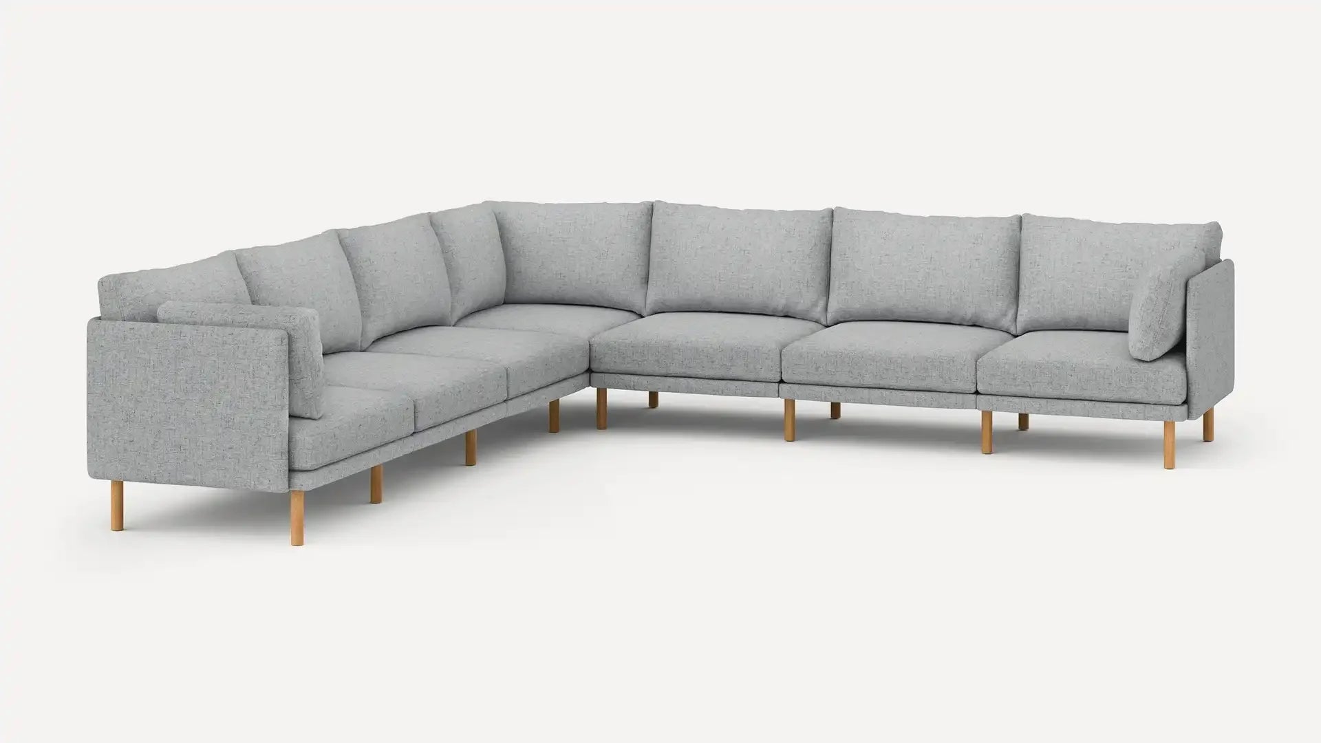 modern l - shaped sectional sofa with light gray fabric upholstery, light wood legs, and clean lines on a white background
