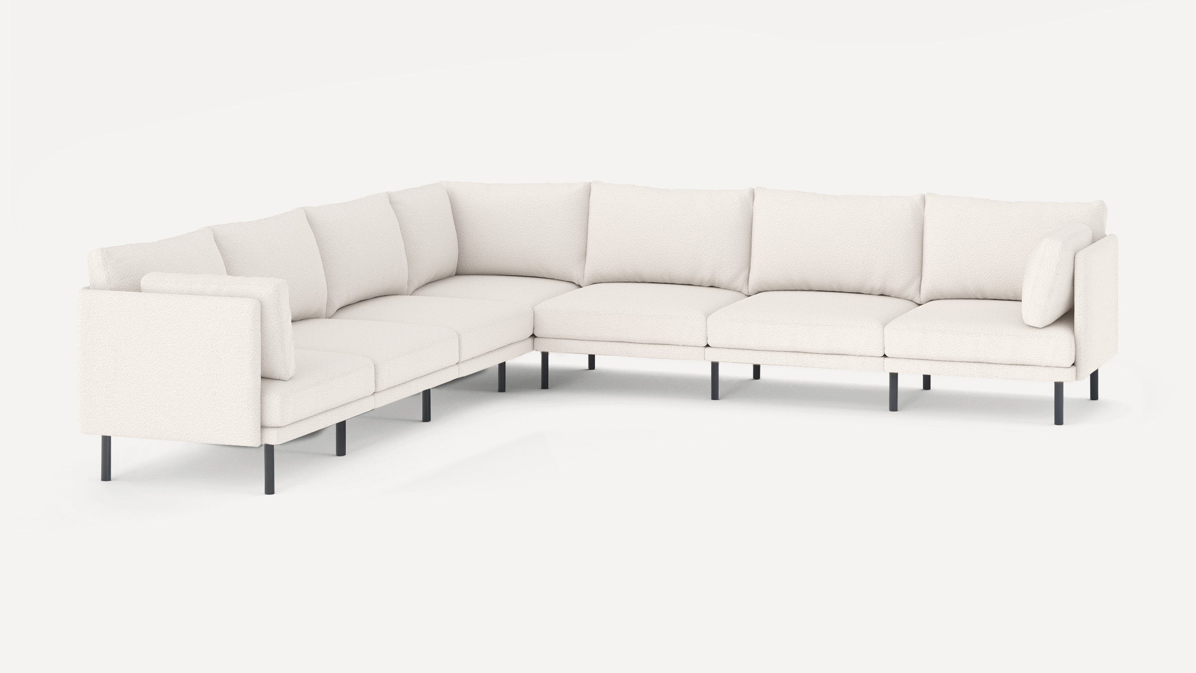 Modern L-shaped sectional sofa with off-white upholstery and slim black metal legs, featuring cushioned backrests and armrests.