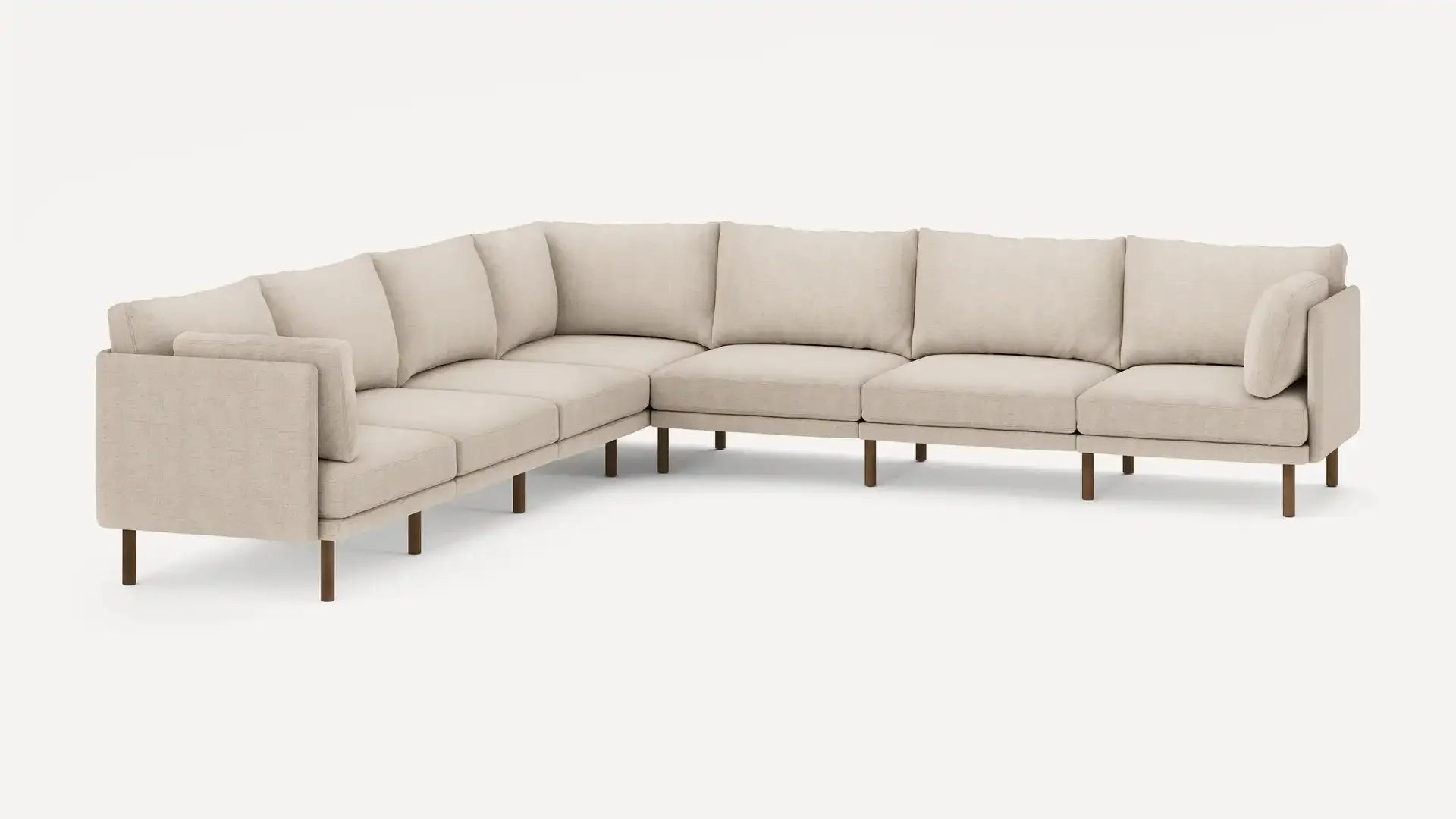 modern l - shaped sectional sofa with beige upholstery and wooden legs, featuring a clean, minimalist design