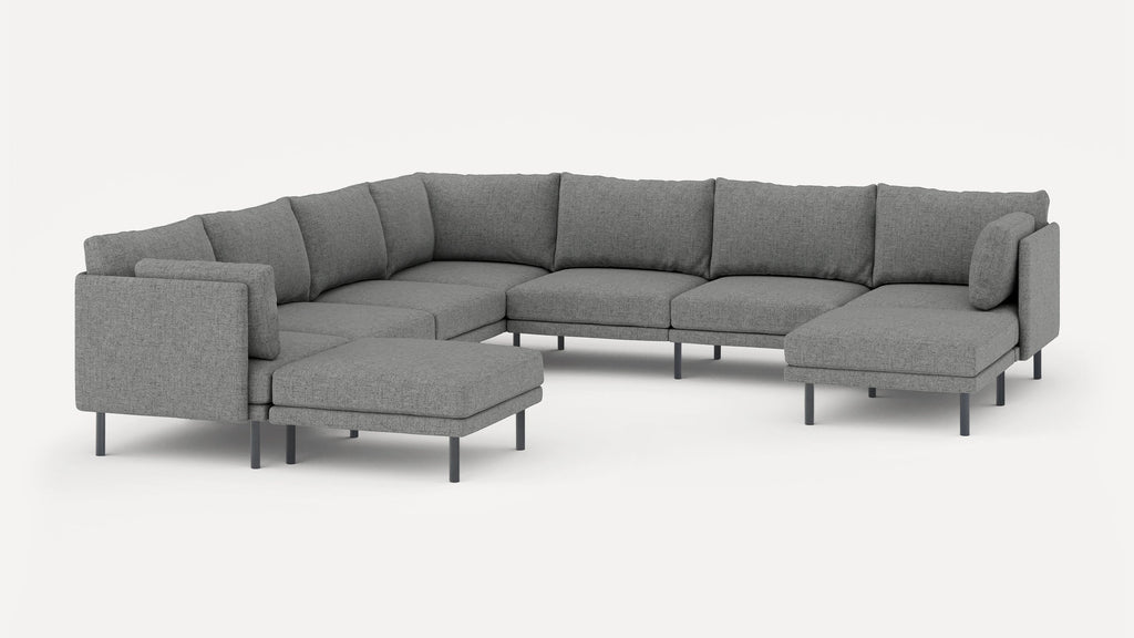 Modern large gray fabric sectional sofa with multiple cushions and elevated metal legs, designed for spacious living areas.
