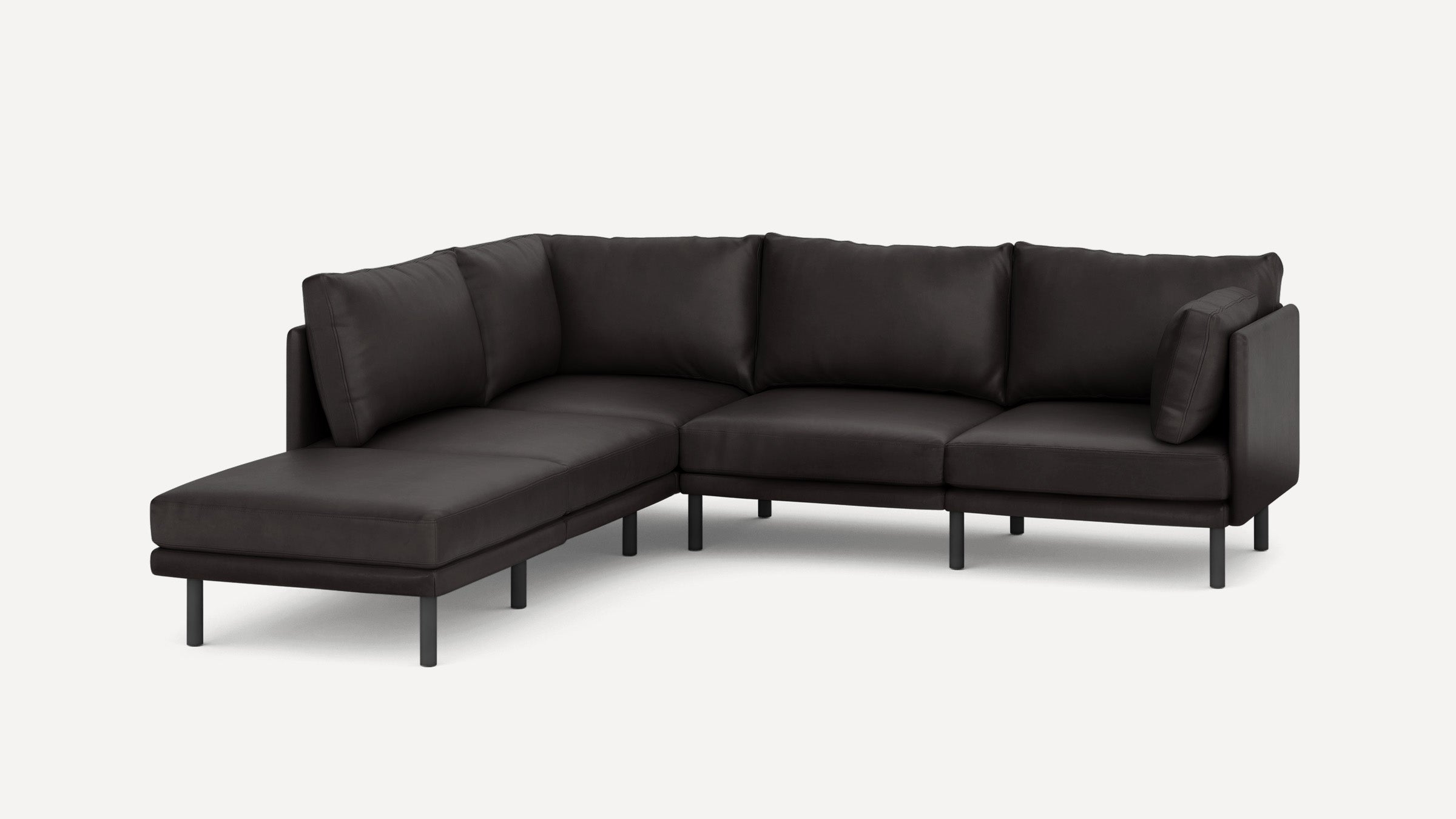 Modern dark gray L-shaped sectional sofa with metal legs, plush cushions, and a chaise lounge on the left side.