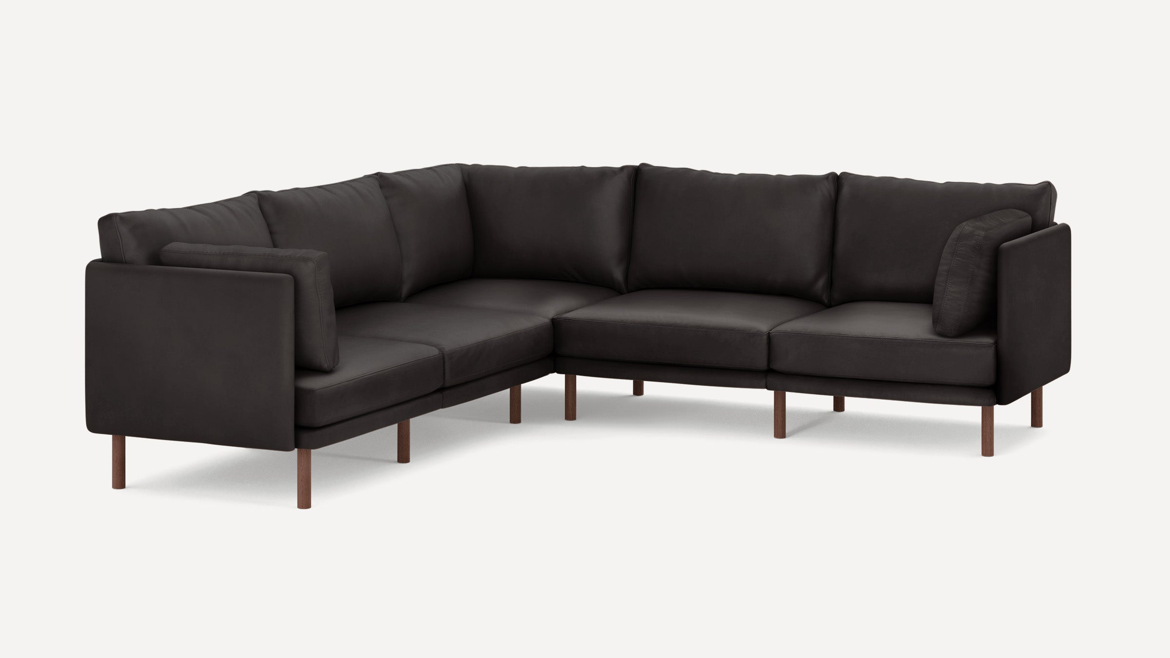 Modern dark gray L-shaped sectional sofa with wooden legs and plush cushions, designed for corner seating.