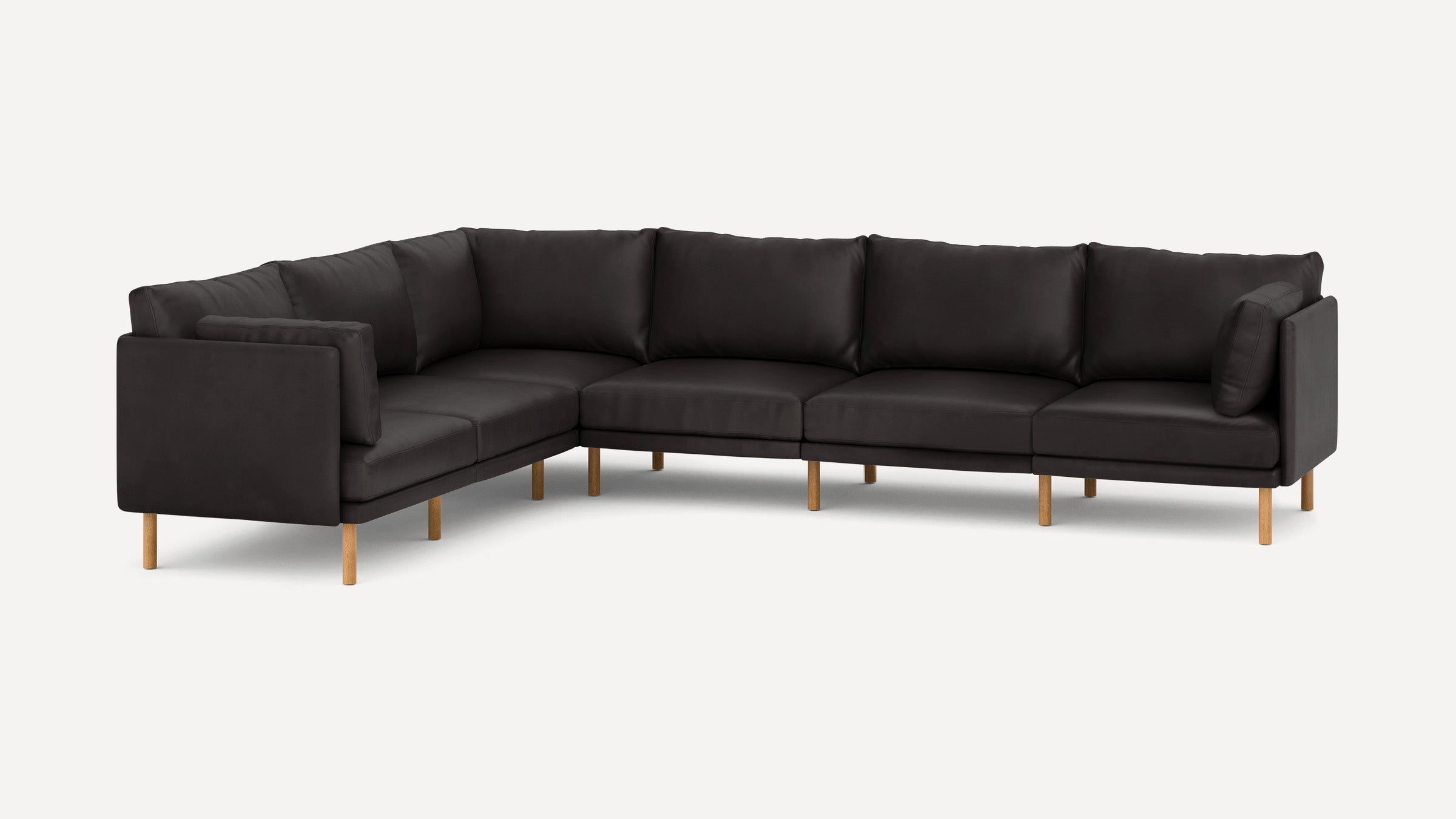 Modern black sectional sofa with wooden legs, featuring clean lines and multiple cushions for comfortable seating.