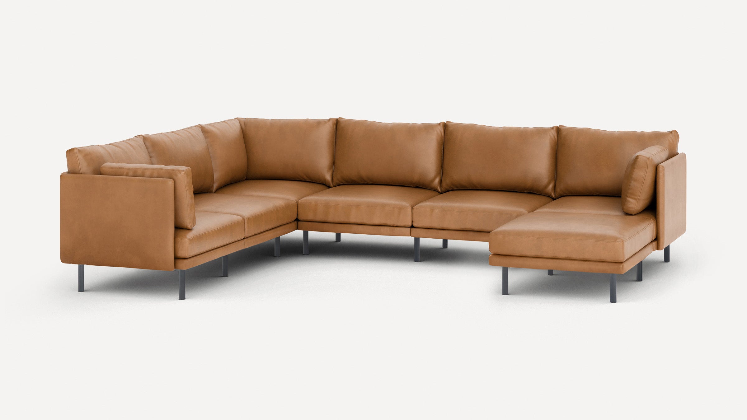 Modern L-shaped sectional sofa with tan leather upholstery, straight arms, back cushions, and metal legs, set against a plain white background.