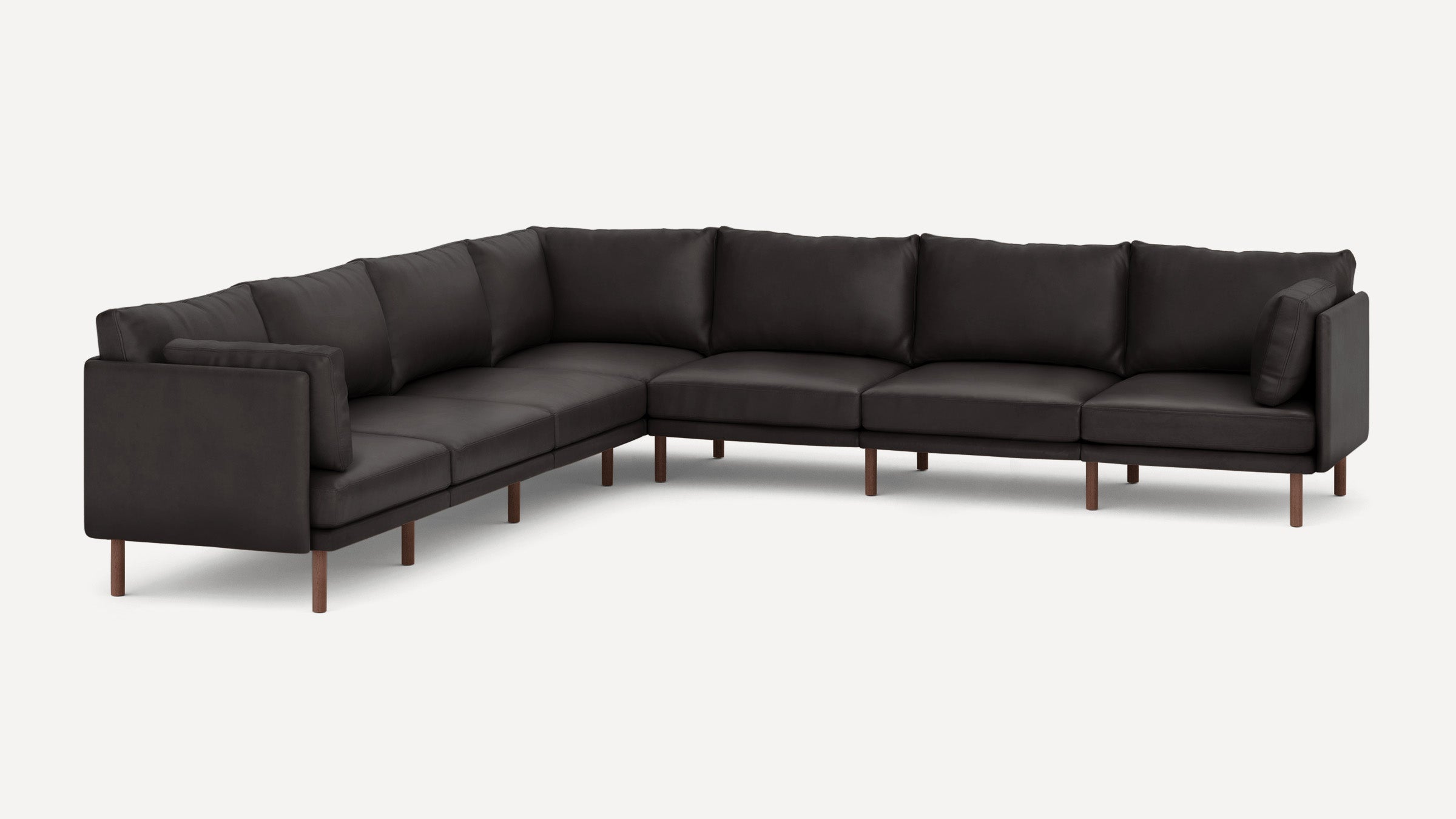 Large modern L-shaped sectional sofa in dark upholstery with wooden legs and cushioned backrests.