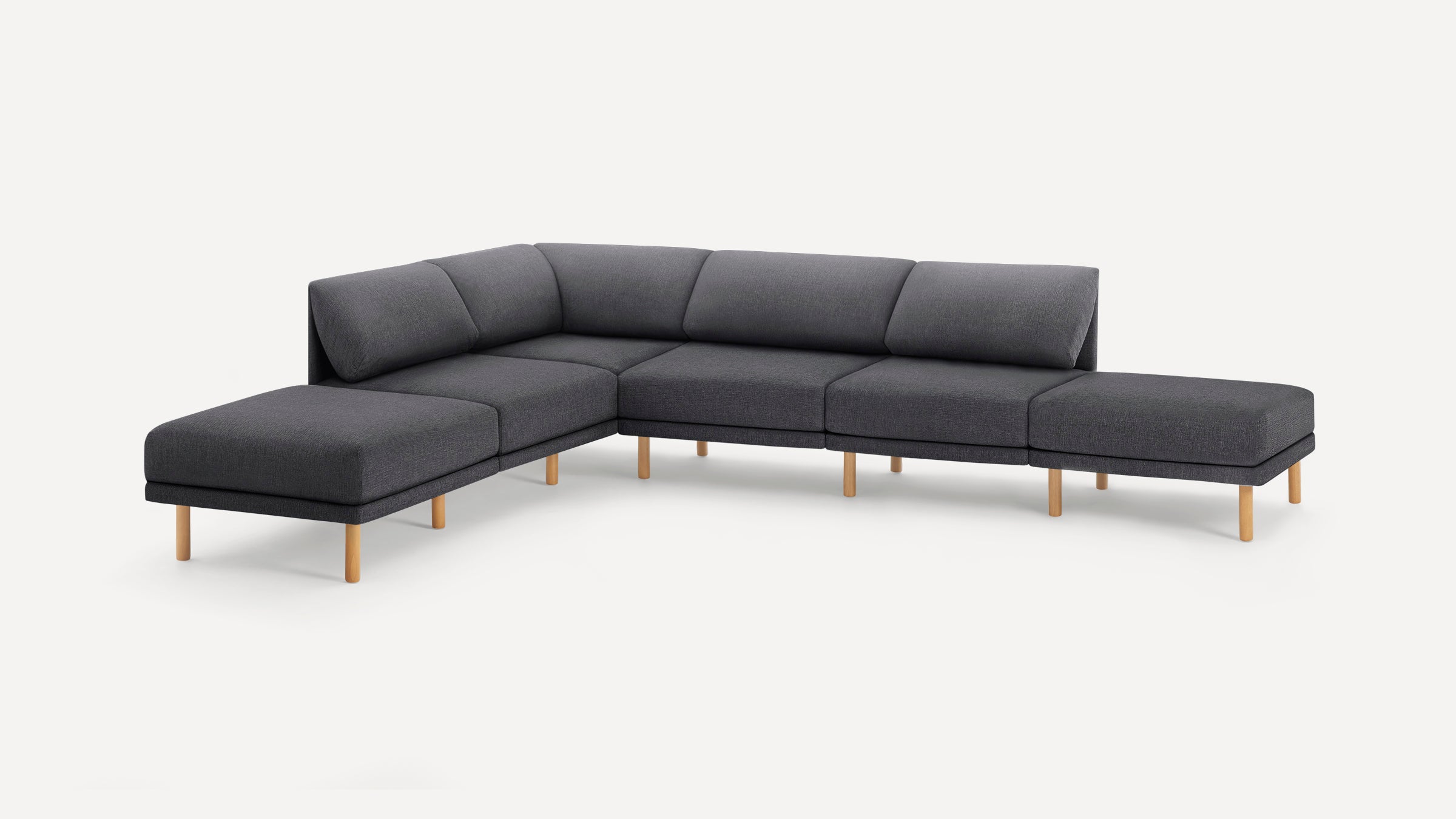 Modern L-shaped dark gray fabric sectional sofa with light wooden legs, featuring clean lines and cushioned backrests.