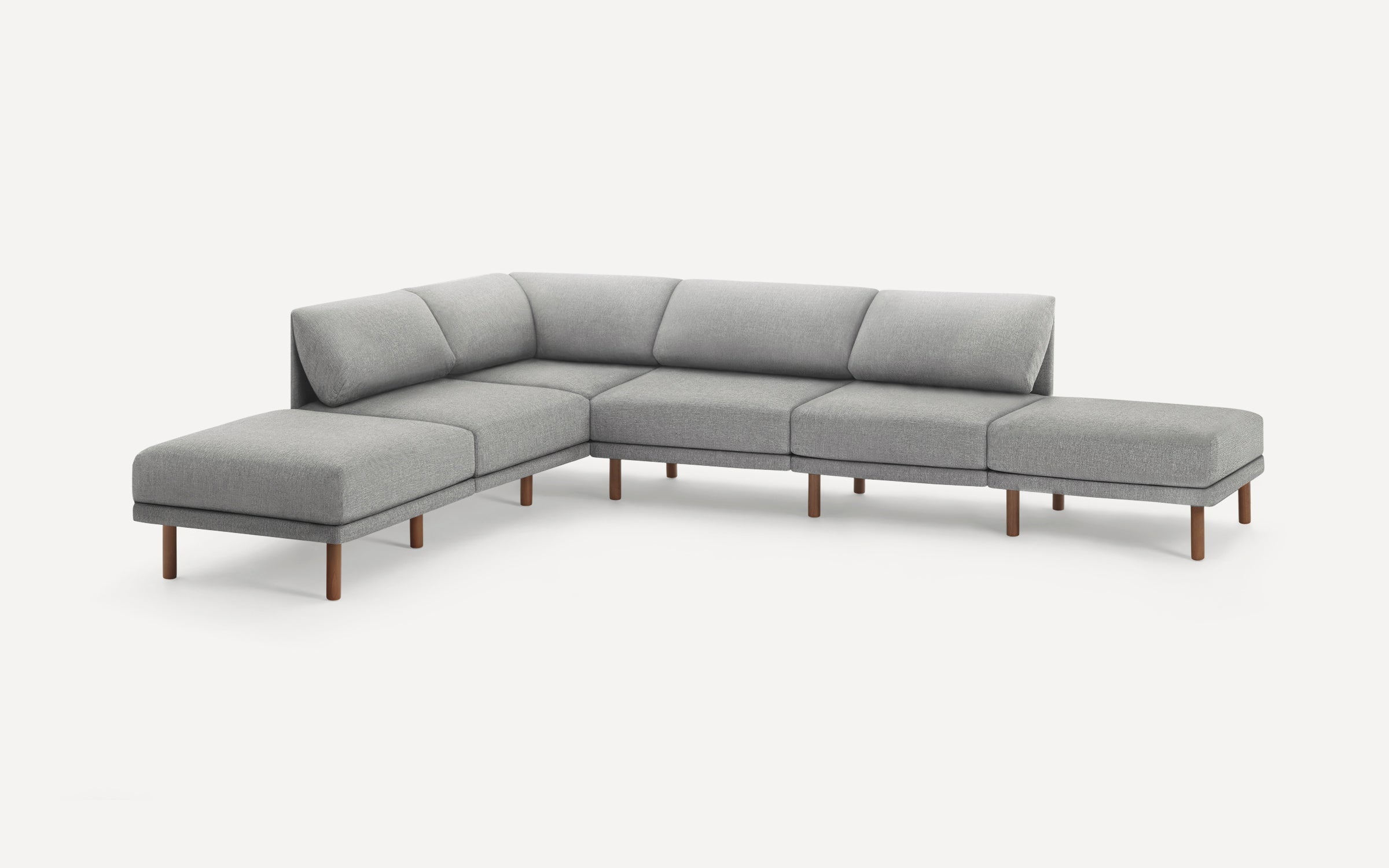 Modern L-shaped sectional sofa with light gray fabric upholstery and wooden legs, designed for spacious seating.