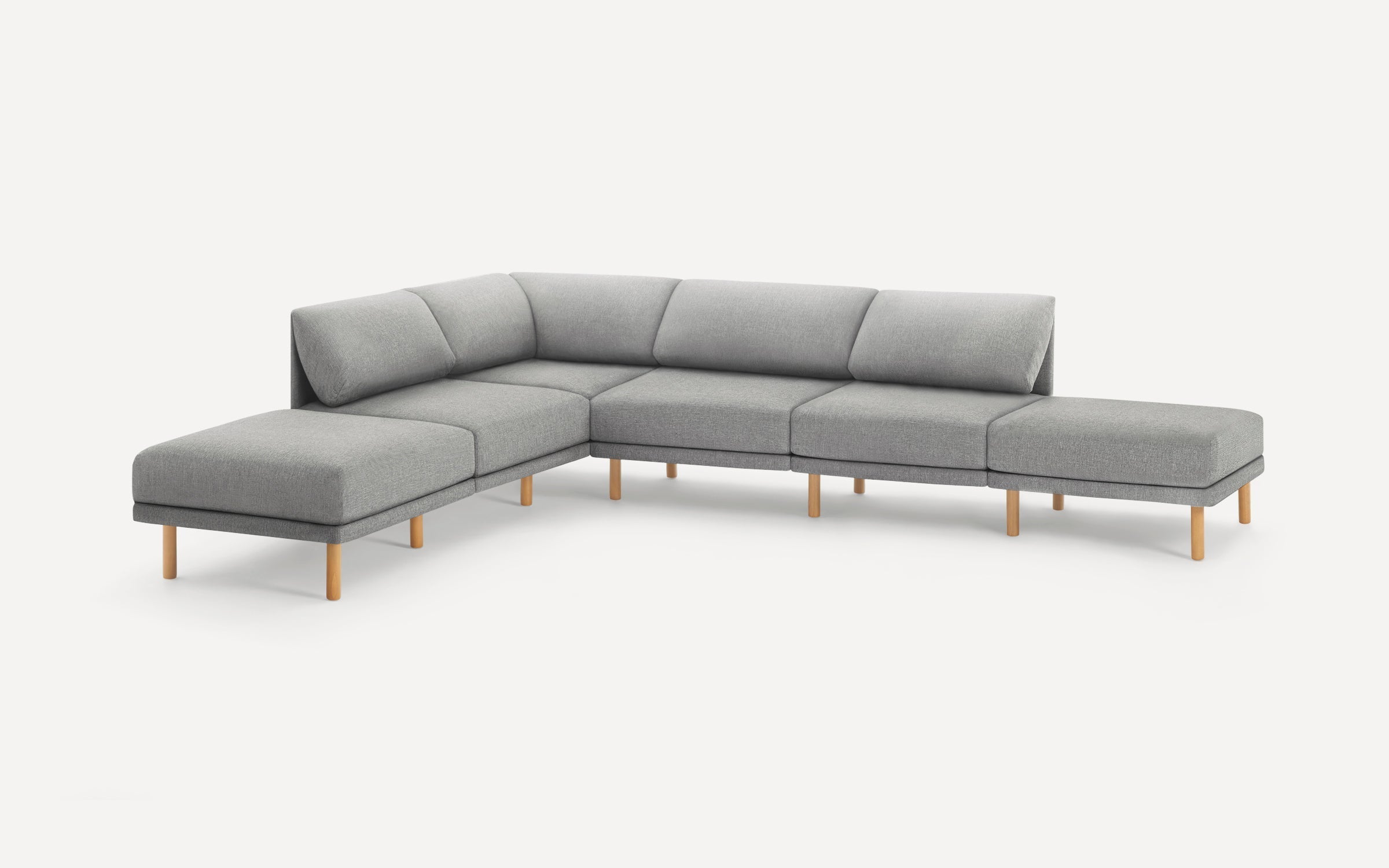 Modern gray sectional sofa with wooden legs, featuring multiple cushioned seats and backrests in an L-shaped design.