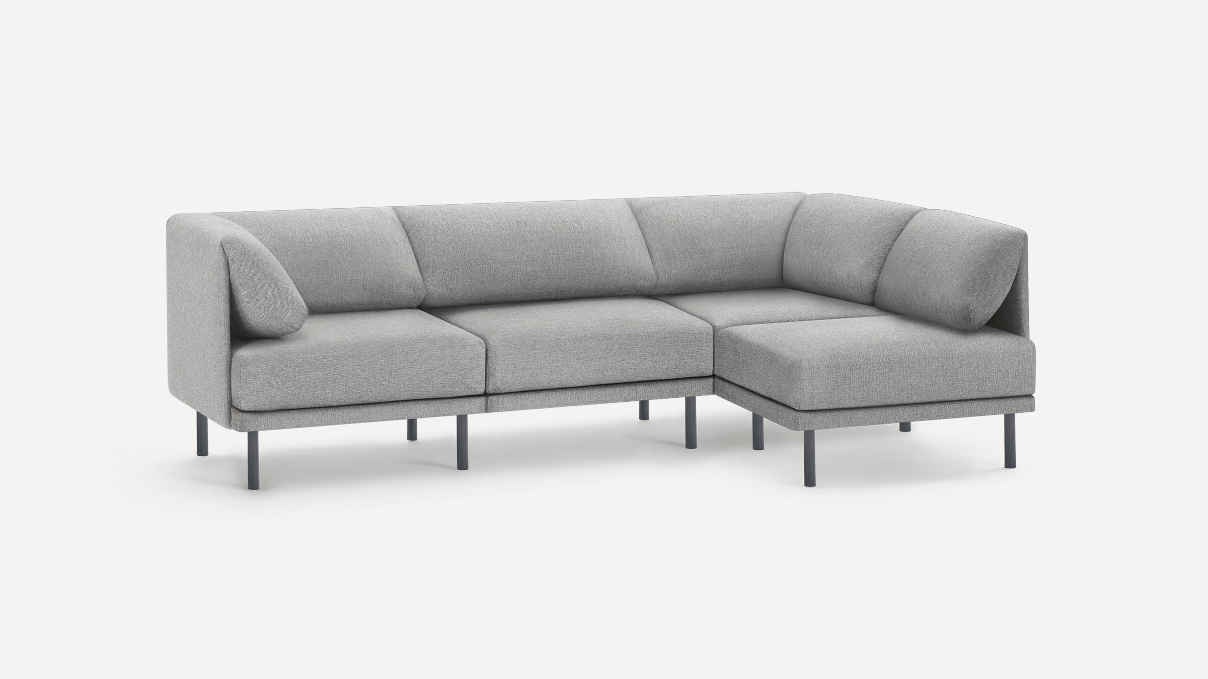 Modern L-shaped sectional sofa with light gray fabric upholstery and black metal legs, featuring clean lines and cushioned backrests.